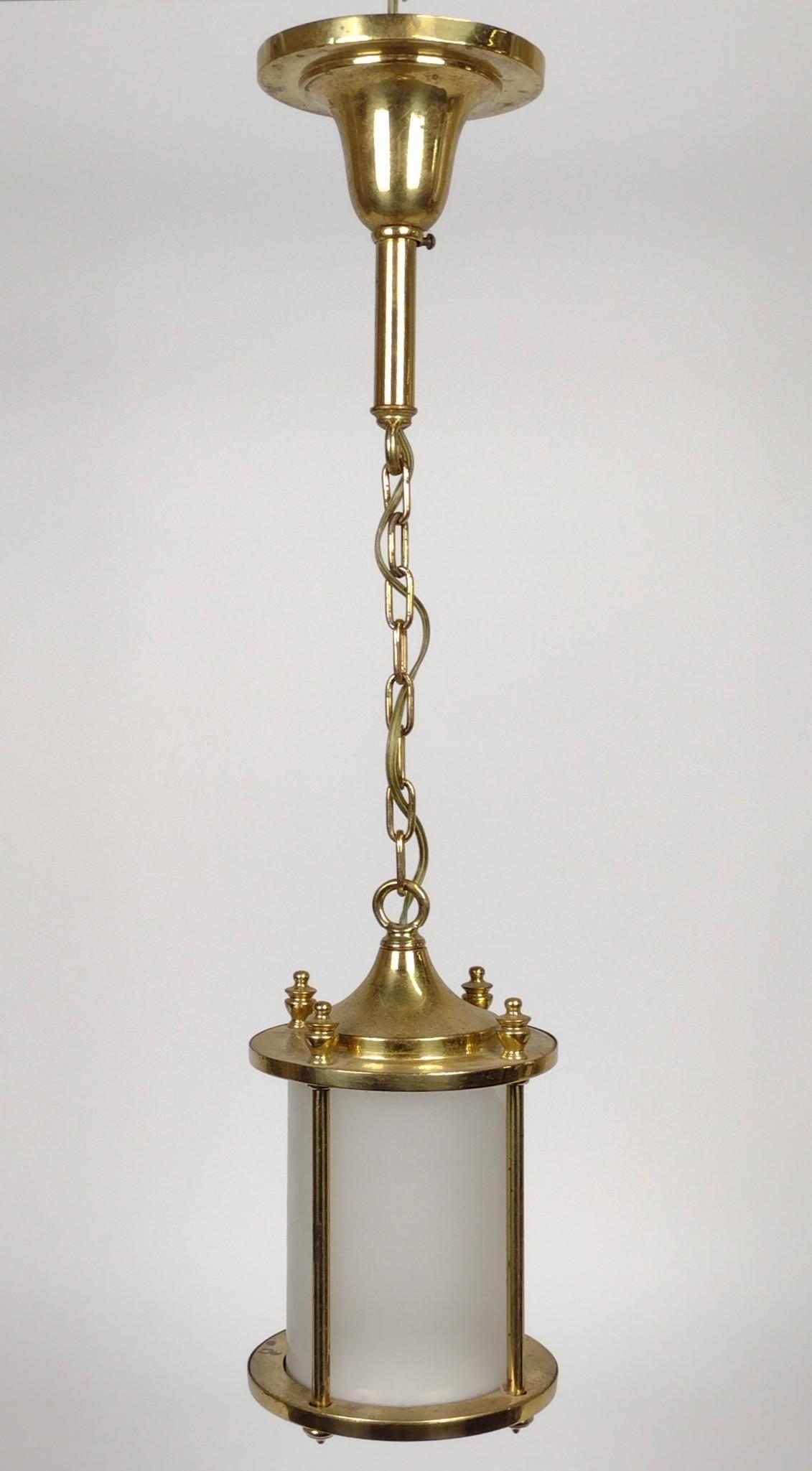 Brass and Frosted Glass Pendant Light: 11" high. Overall with chain: 28" high. IMPORTANT: Before bidding, please read the terms and conditions. When you registered for the auction you agreed to these terms and will be required to comply wi