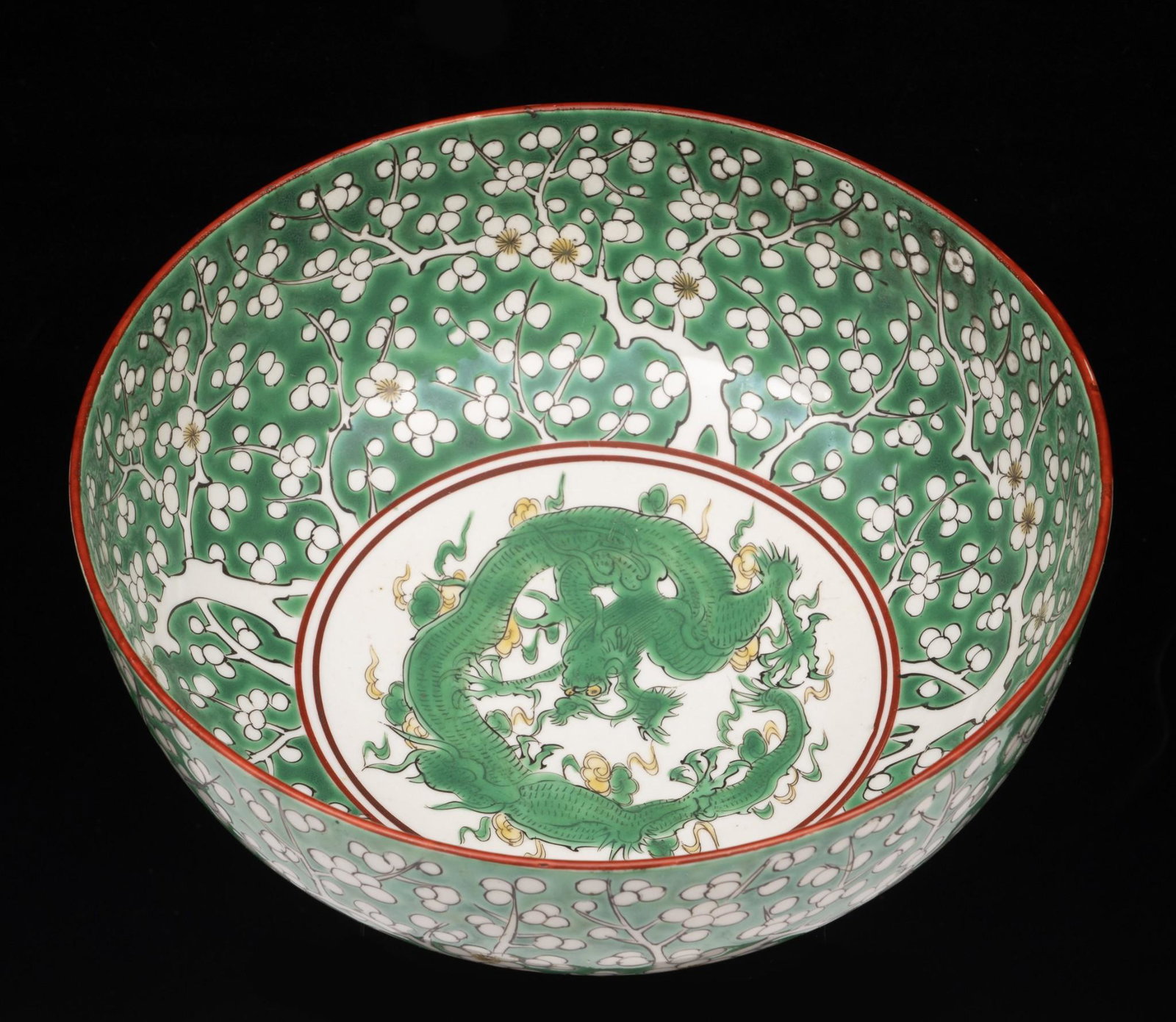 Chinese Porcelain Dragon and Apple Blossom Bowl: DESCRIPTION: Chinese porcelain dragon and apple blossom bowl. Four character mark to bottom. MEASUREMENTS: 8-1/4" diameter x 3-3/4" high. CONDITION: Very good. No defects found. MH IMPORTANT: Before b