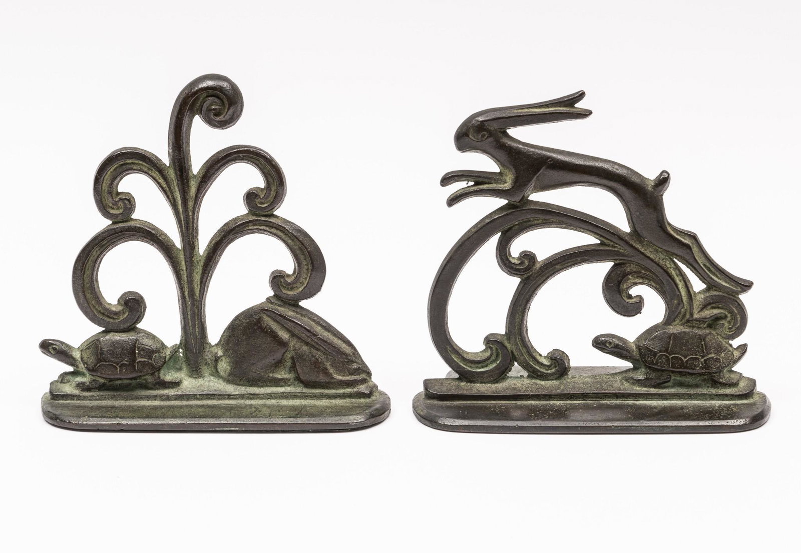 Wm F Boogar (American, 1893-1958) Tortoise and Hare Bookends: DESCRIPTION: Pair of William F. Boogar (American, 1893-1958) bronze bookends depicting the tortoise and the hare. Each signed to reverse. Felt to bottom of one. MEASUREMENTS: 4-7/8" to 5-1/8" high x 5