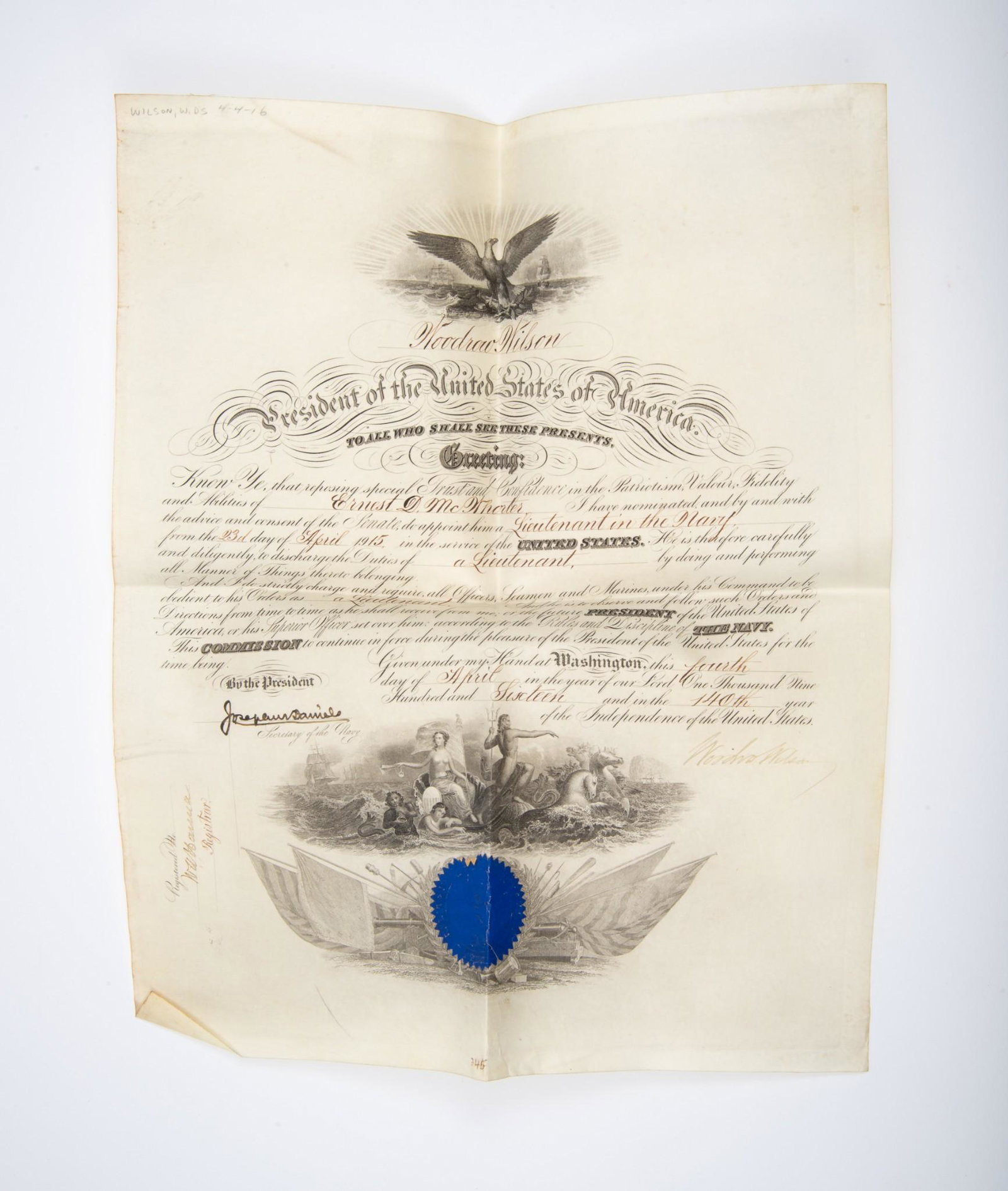 Original Commission Signed by Pres Woodrow Wilson: A printed and scrivened manuscript military commission naming Ernest D. McWhorter a Lt. in the United States Navy. Dated 1916 and bearing an original signature of President Woodrow Wilson in the lower