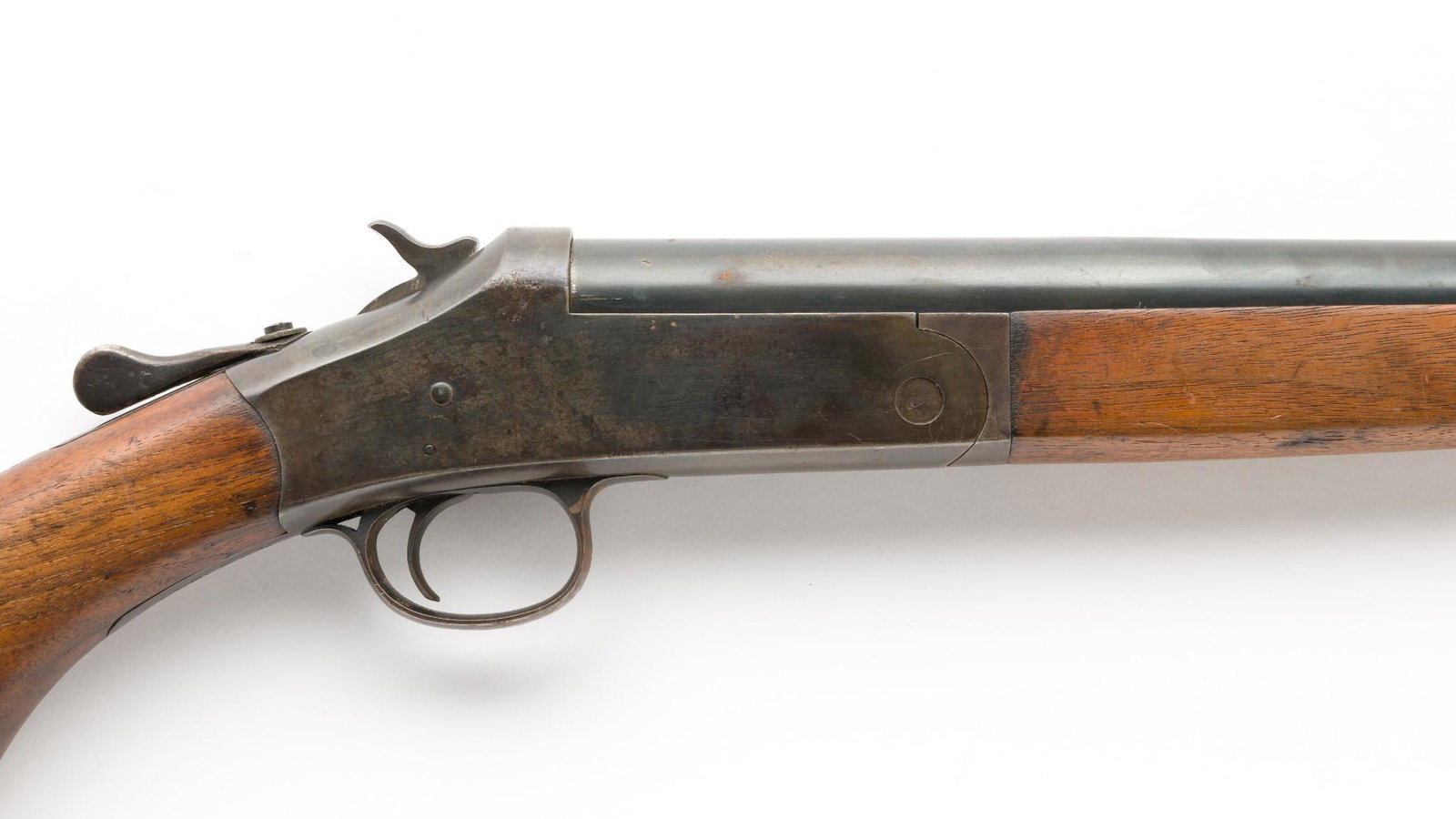 Harrington & Richardson Single Shot Shotgun, 20 Gauge: Serial Number: A323955 Design: H&R single shot shotgun with 20" barrel and full choke.Last patent date: Feb. 27, 1901. Brass plaque on stock "Mille Lacs Chippewa Agency." Condition: Good.Spots of corr
