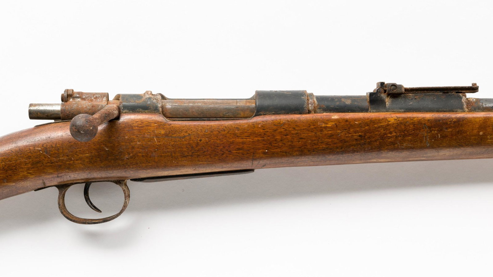 Spanish Mauser (Ovideo) Cal. 7mm, Cut Down: Serial Number:O 5052 Design: 7mm Mauser caliber. Barrel cut to 21 1/2". Marked "Fabrica de Armas Ovideo 1906" on receiver ring. Condition: Poor.Corrosion overall, heavy on bolt. Inventory No./Category
