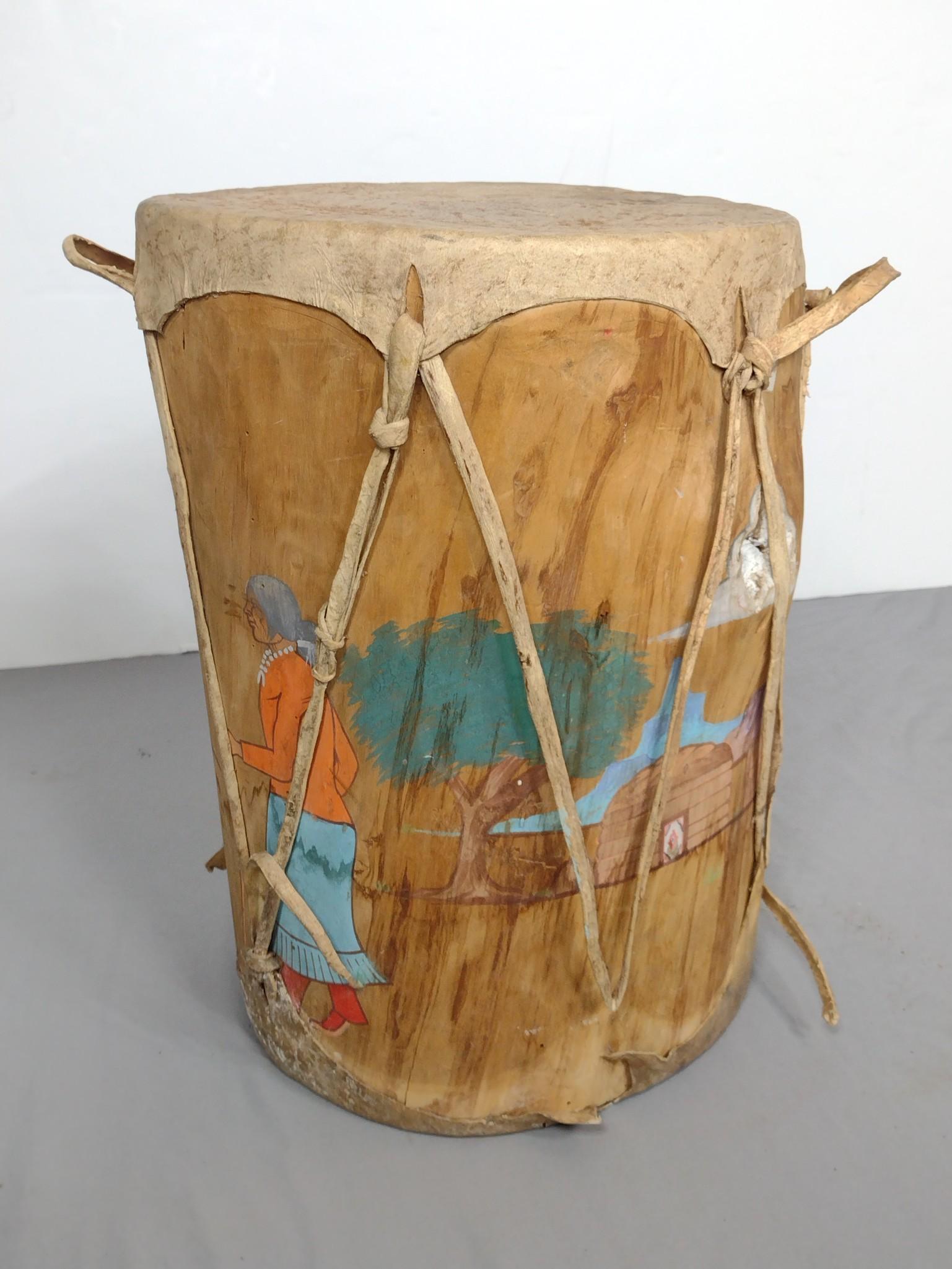 Painted Native American Ceremonial Drum: 13-3/4" diameter X 19-3/4" high. One leather eyelet has damage. MG. IMPORTANT: Before bidding, please read the terms and conditions. When you registered for the auction you agreed to these terms and w