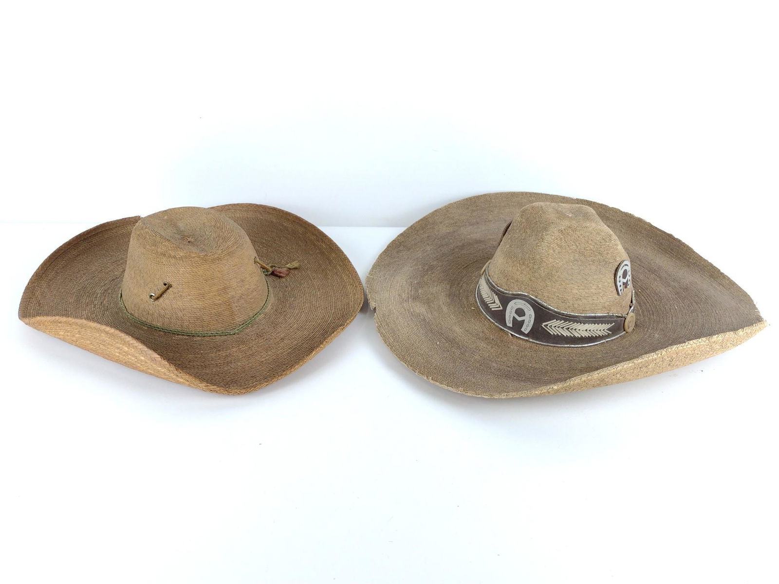 2 Vintage Sombreros: One with silver decorated hat band labeled Pigalle. Small 15-1/4"long x 14-1/4" wide. Large 18" long x 17-1/4" wide. DP. IMPORTANT: Before bidding, please read the terms and conditions. When you regis
