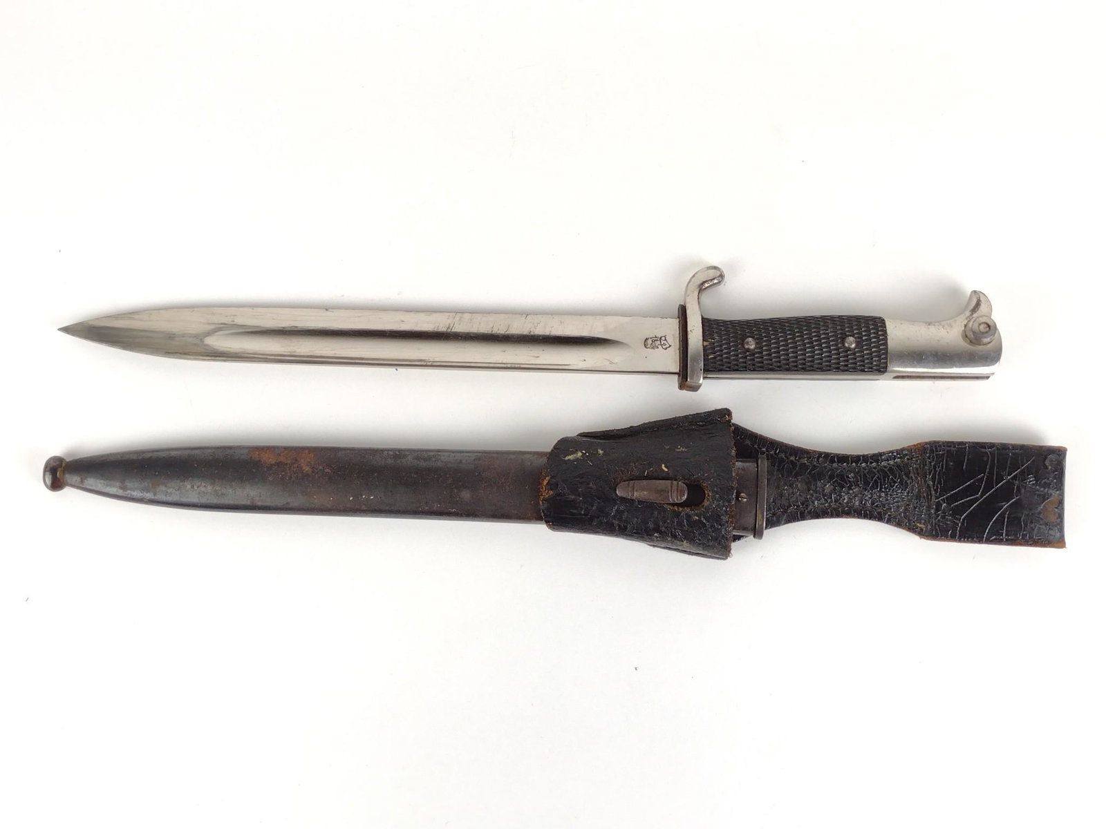 German Dress Bayonet: In metal sheath with leather frog. Overall 16-3/4" long. Blade 10" long. Leather frog with tear. Sheath with corrosion.DP. IMPORTANT: Before bidding, please read the terms and conditions. When you reg