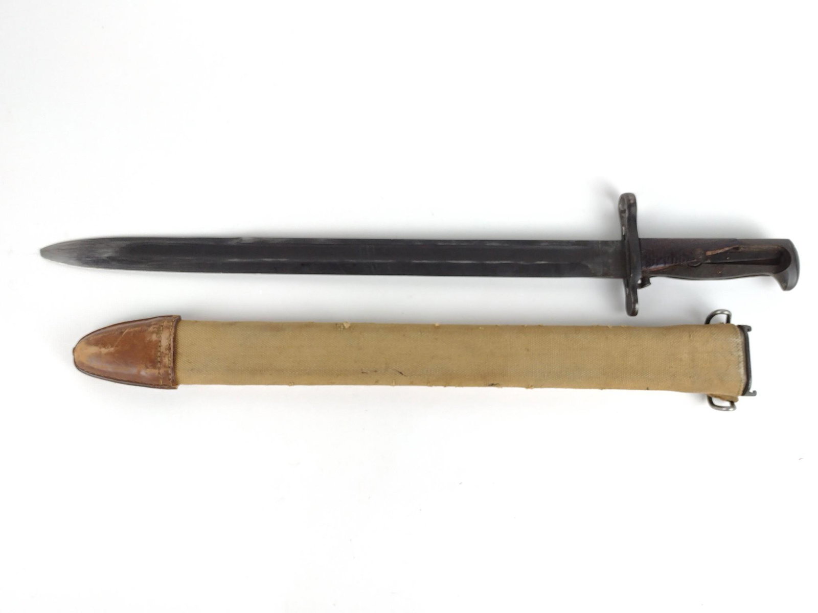 M1905 E1 Bayonet: U.S. Ordnance Corps with sheath. Overall 22" long. Blade 15-3/4" long. Handle with loss to wood. DP. IMPORTANT: Before bidding, please read the terms and conditions. When you registered for the auctio