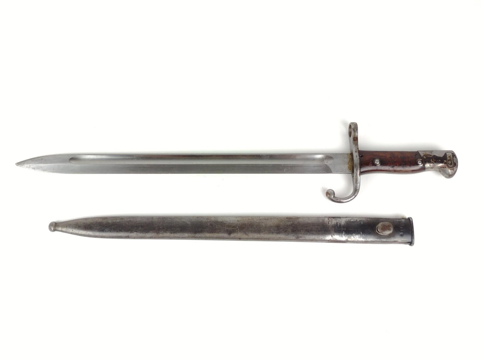 Argentine Weyersburg 1909 Bayonet: With sheath SN D 7167. Overall 21-1/4" long. Blade 13-3/4" long. DP. IMPORTANT: Before bidding, please read the terms and conditions. When you registered for the auction you agreed to these terms and 