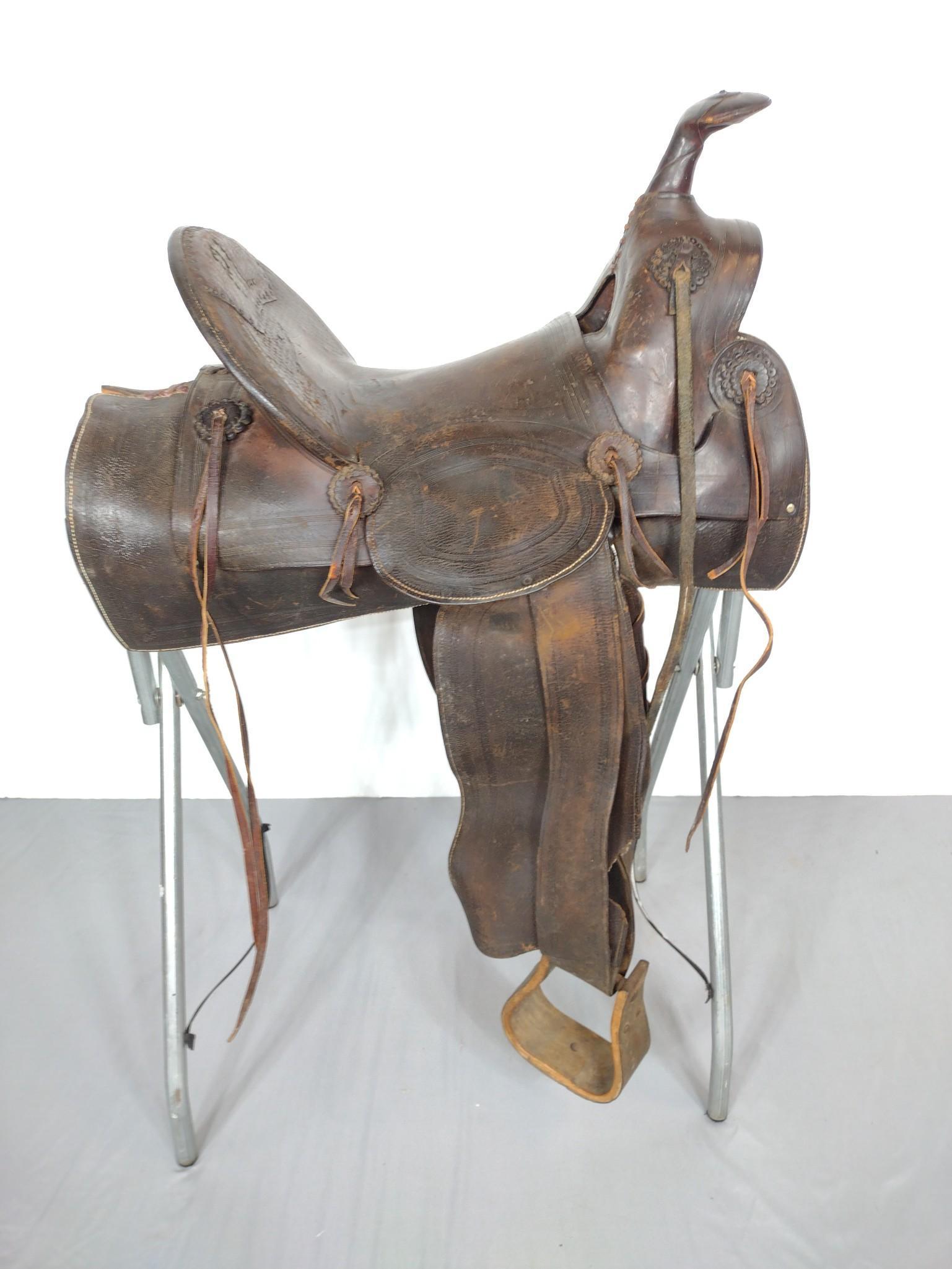 Felife J. Villaescusa Western Saddle: Tucson, AT. 18" wide X 26" deep X 38-1/2" high. Has some scratches and discoloring. Saddle stand not included. MG. IMPORTANT: Before bidding, please read the terms and conditions. When you registered 