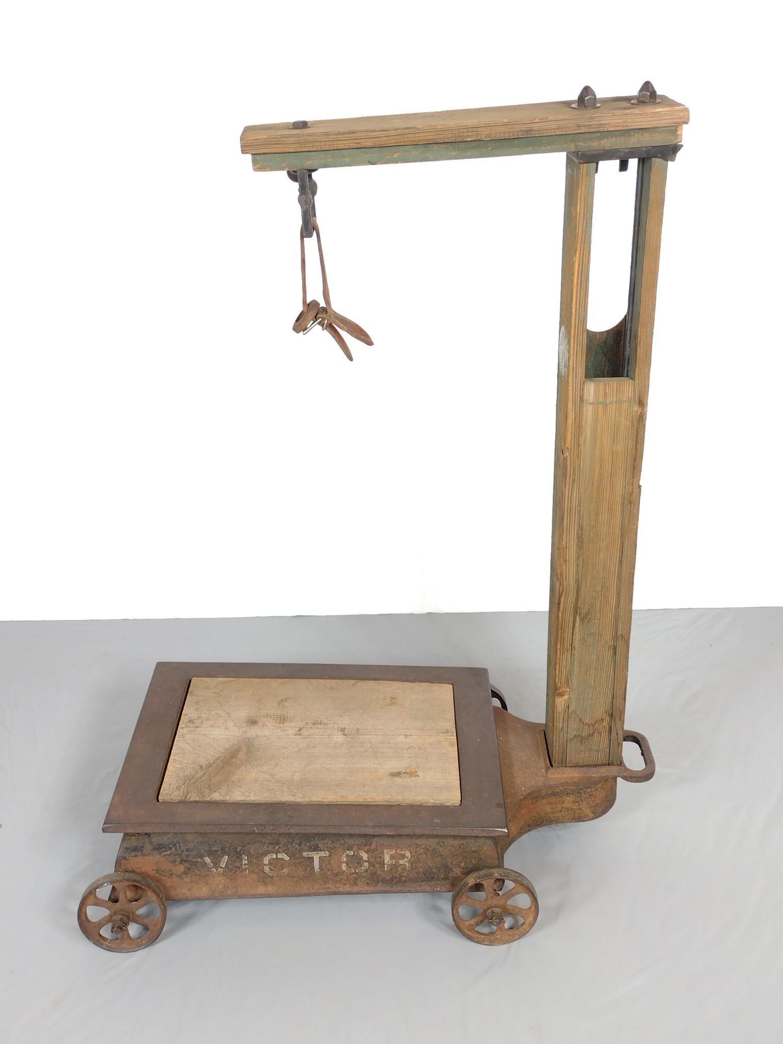 Antique Victor Scale: 21" wide X 33-1/2" deep X 44" high. MG. PC-240. IMPORTANT: Before bidding, please read the terms and conditions. When you registered for the auction you agreed to these terms and will be required to c