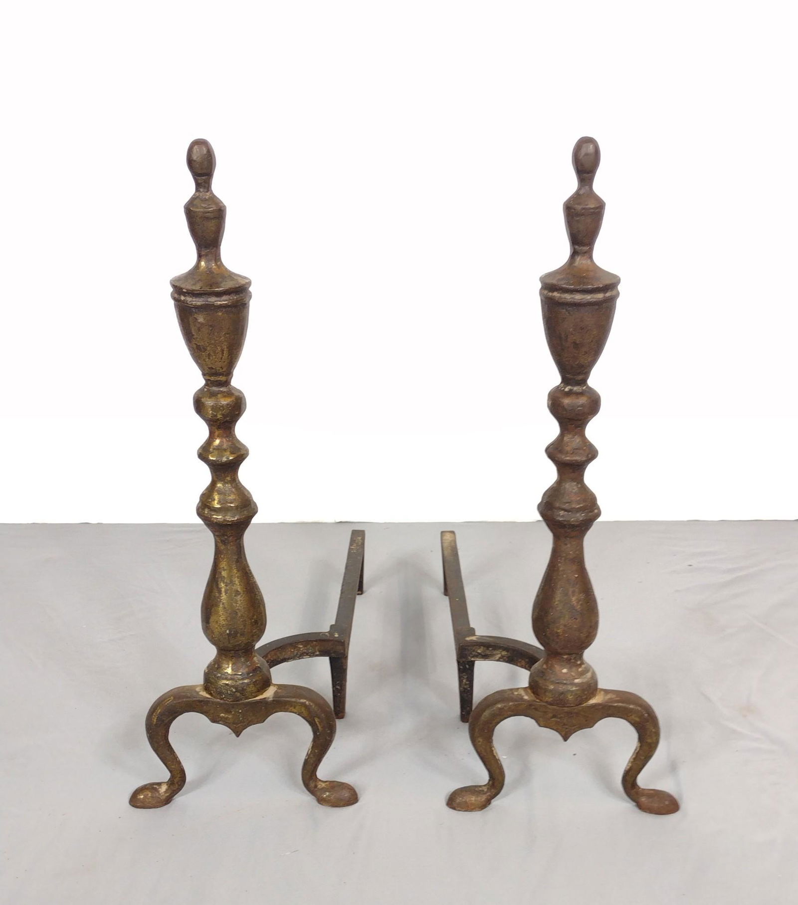 Antique Brass Andirons: 7-1/2" wide X 18-1/2" deep X 22-1/2" high. MG. PC-119. IMPORTANT: Before bidding, please read the terms and conditions. When you registered for the auction you agreed to these terms and will be requir