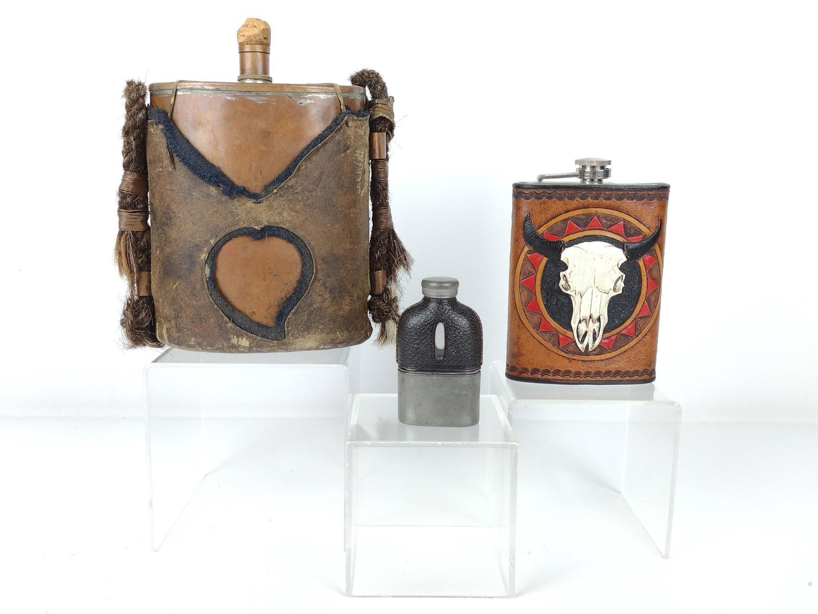 3 Flasks Incl Kelly Silvertip: Includes medicine flask, copper flask in leather carrying case, and Kelly Silvertip leather wrapped flask. 3-1/2" to 8-1/4" high x 2-1/4" to 7" wide. DP. IMPORTANT: Before bidding, please read the ter