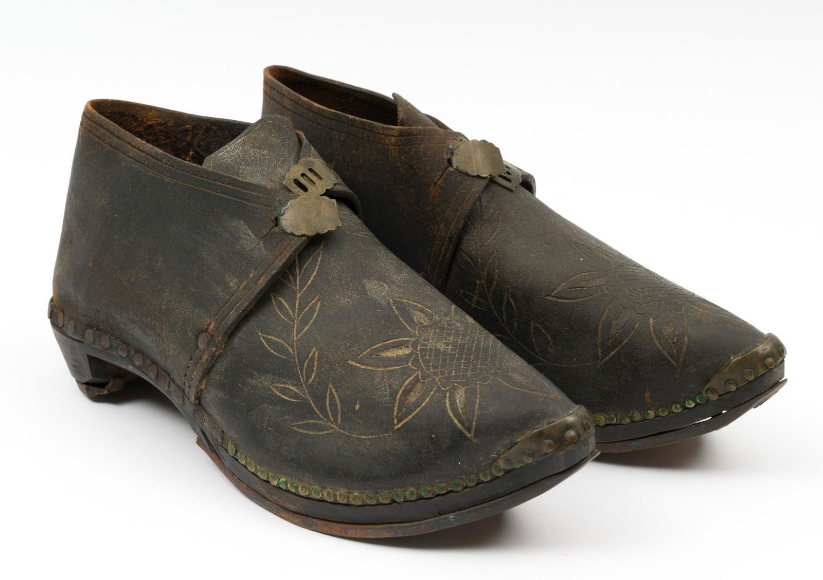 Leather Shoes with Sunflower Design: 20th century. Possibly East European. Unusual construction. 10" long x 3" wide x 4-1/2" high. RM IMPORTANT: Before bidding, please read the terms and conditions. When you registered for the auction yo