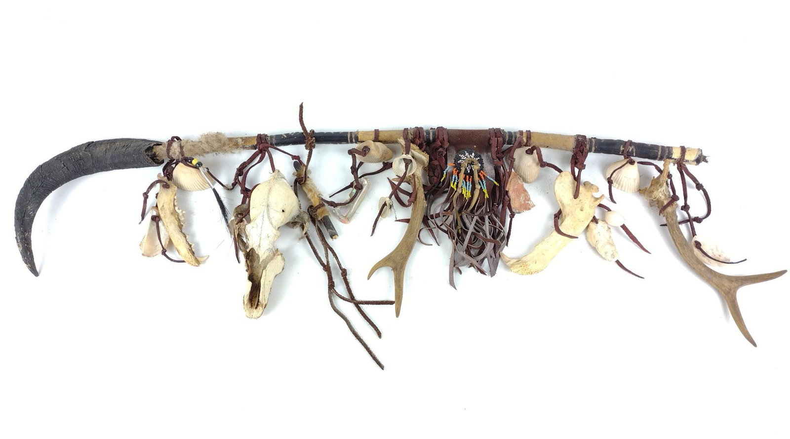 Spirit Stick with Skull, Teeth, Antlers, & Horns: Also some bead work. 34-1/4" long. DP. IMPORTANT: Before bidding, please read the terms and conditions. When you registered for the auction you agreed to these terms and will be required to comply wit