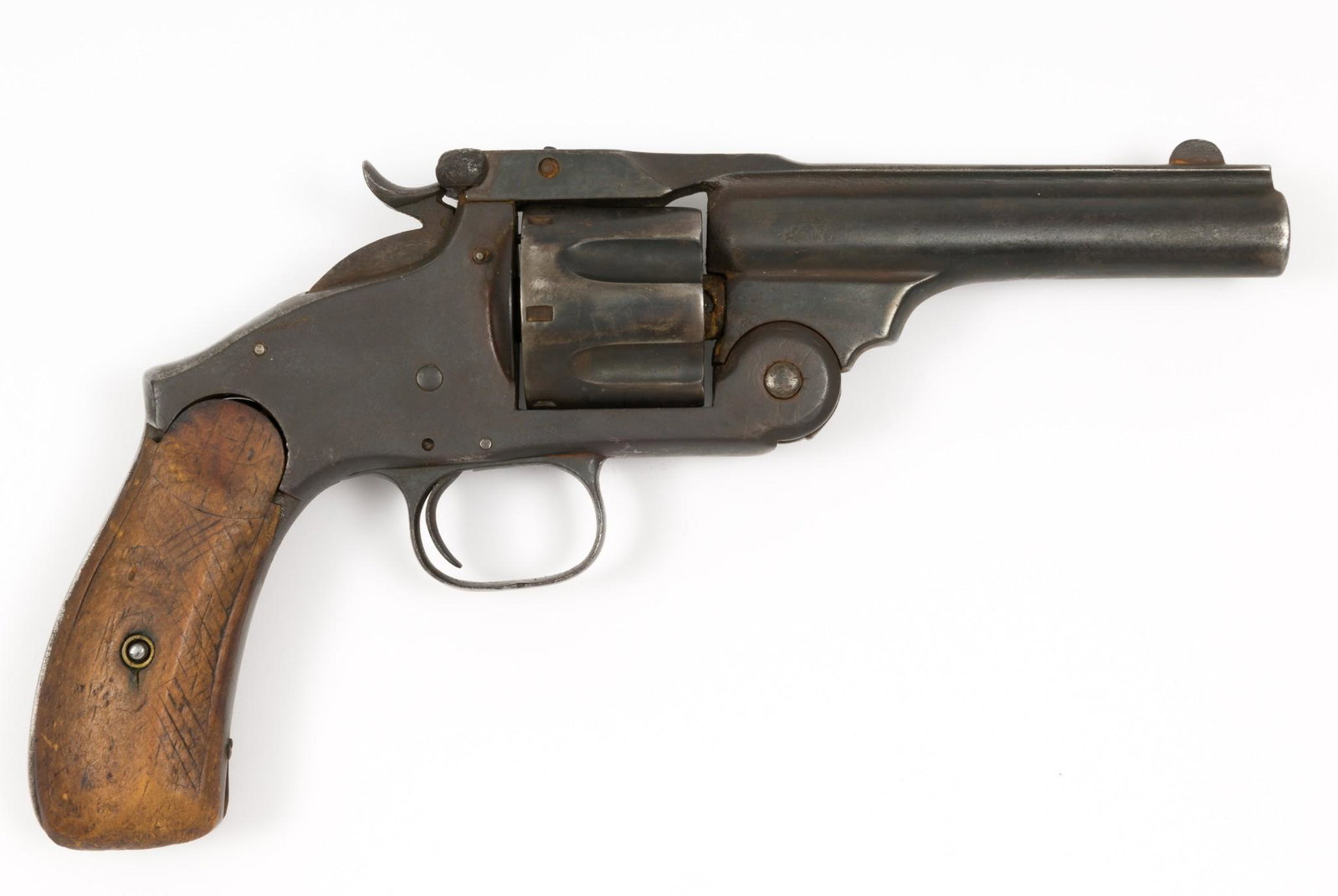 Relic Condition Belgian Copy of S&W-style Revolver, Cal. .44: Serial Number: 939 Design: 19th century Belgian revolver is a loose copy of the S&W format of the era. 4-3/4" barrel. Appears to be .44 caliber. No maker's mark or proofs evident. Grip panels look to 