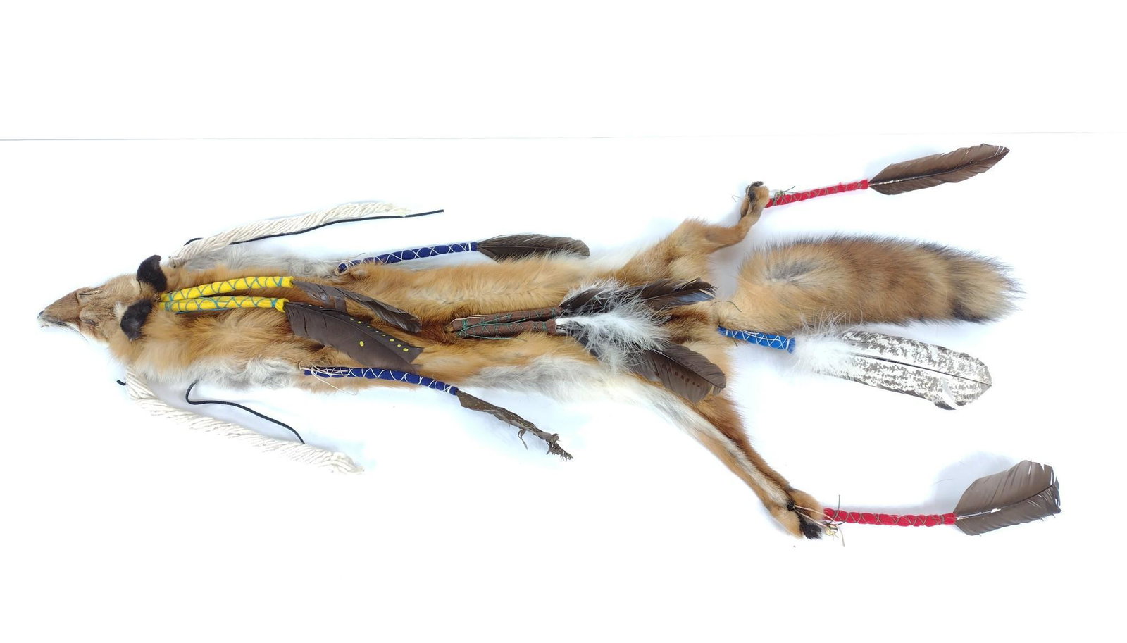 Fox Hide With Feather Embellishments: 20" wide X 48" long. MG. IMPORTANT: Before bidding, please read the terms and conditions. When you registered for the auction you agreed to these terms and will be required to comply with them.