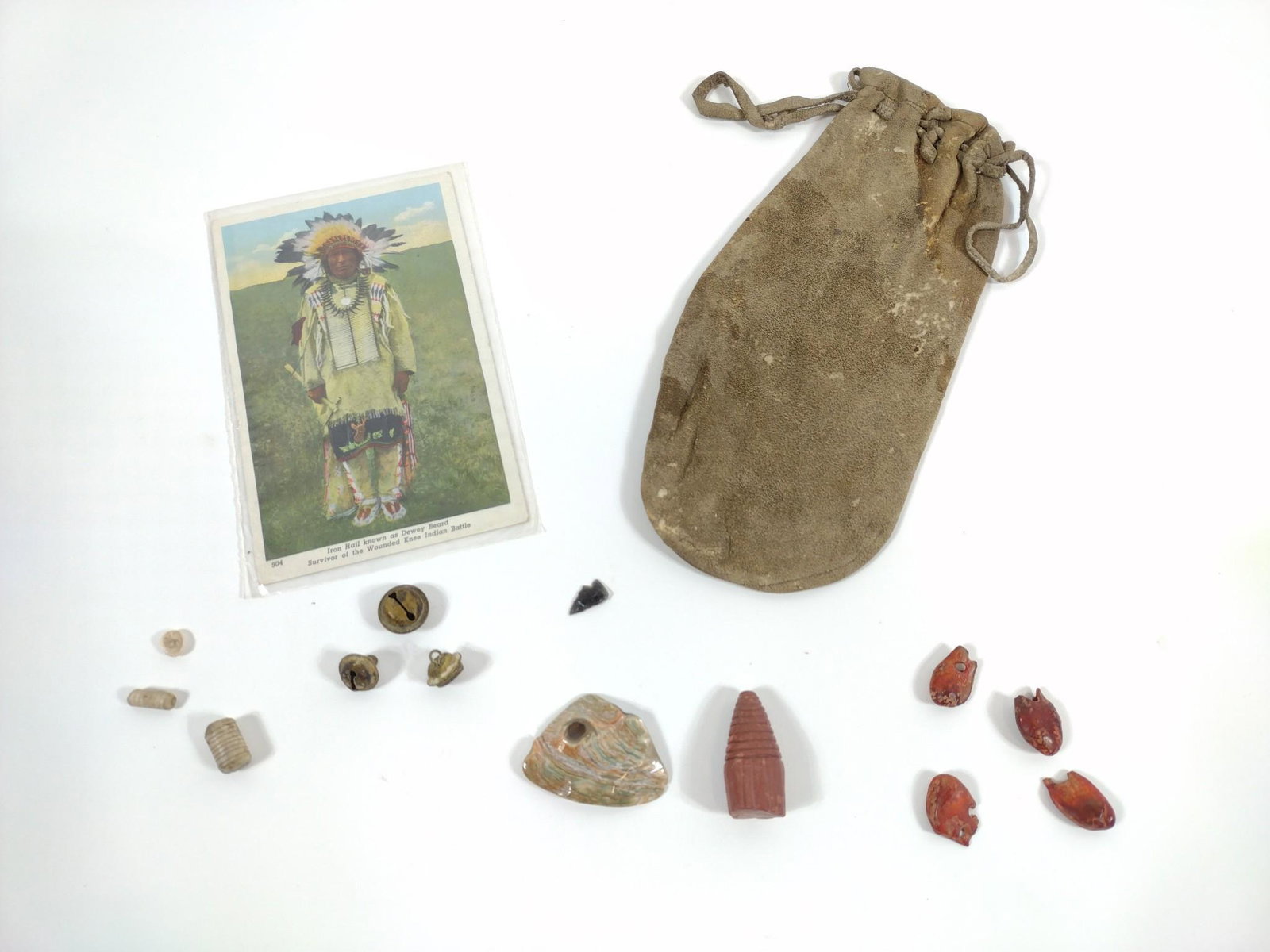 Dewey Beard "Iron Hail" Display: Includes pouch, postcard, beads and buttons. 14pcs. MG. IMPORTANT: Before bidding, please read the terms and conditions. When you registered for the auction you agreed to these terms and will be requi