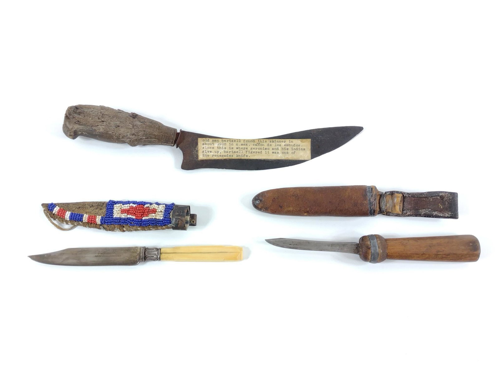 3 Vintage Knives Incl Hand Forged: 9-1/2" X 12-1/2" long. One knife with beaded sheath and copper belt clip marked "US15". MG. IMPORTANT: Before bidding, please read the terms and conditions. When you registered for the auction you agr