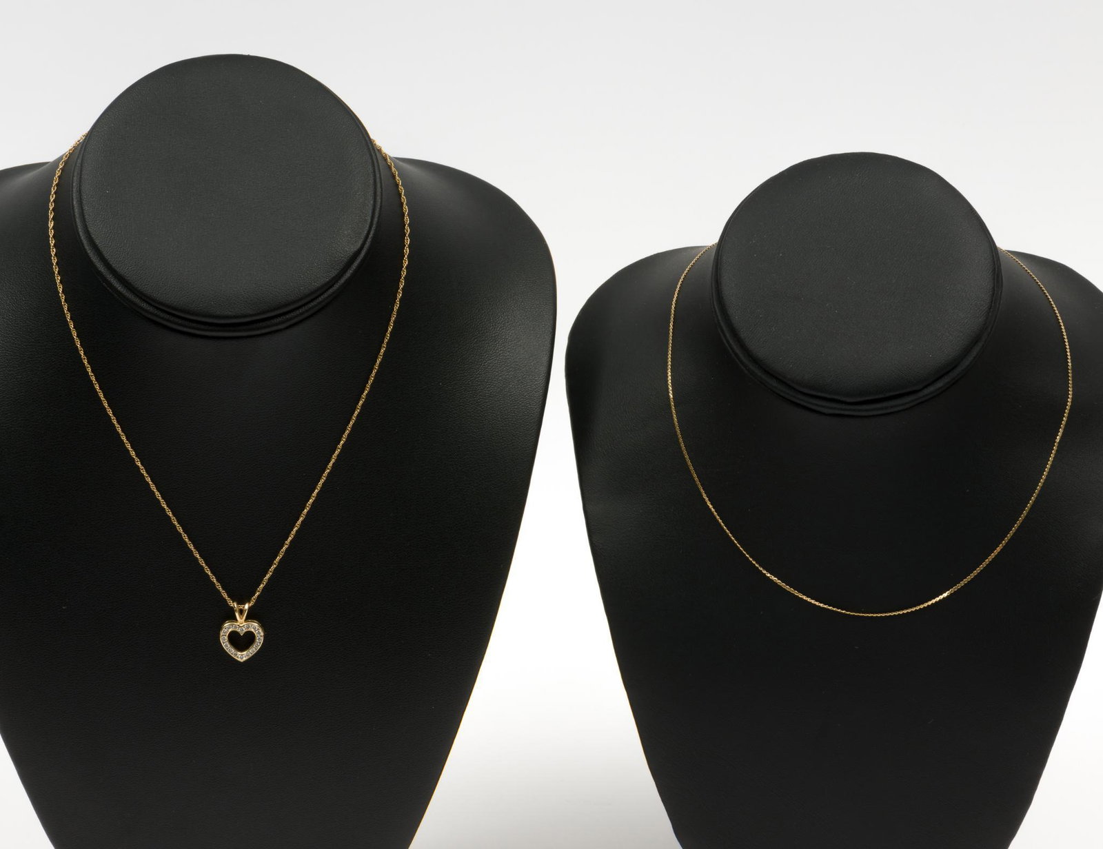 2 14K Chains & Diamond Heart Pendant: 14k chain and heart pendant set with sixteen 2-point each diamonds, .32 CTW. Chain 16" long, pendant 3/4" high. 14k chain, 15" long. Total weight 2.4 dwt. EK IMPORTANT: Before bidding, please read the