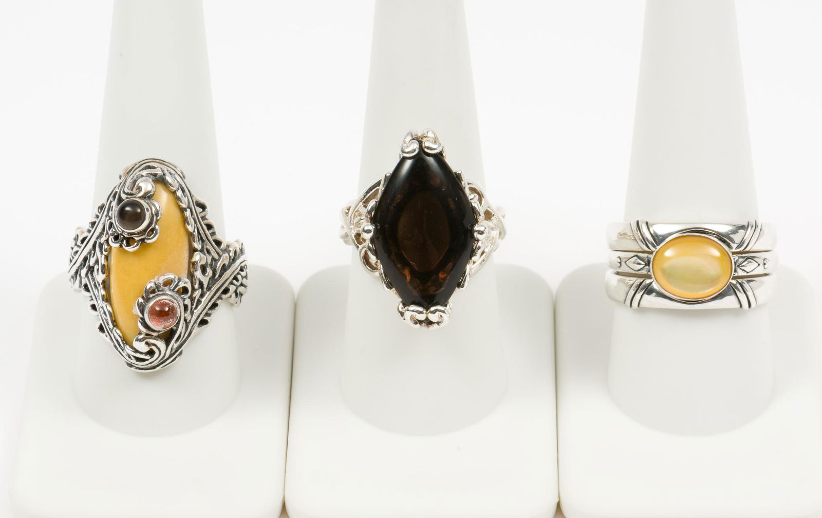 5 Sterling Carolyn Pollack Rings: Includes ring trio, size 10. Smokey Quartz ring, size 8.5. Jasper ring, size 10. LM IMPORTANT: Before bidding, please read the terms and conditions. When you registered for the auction you agreed to t
