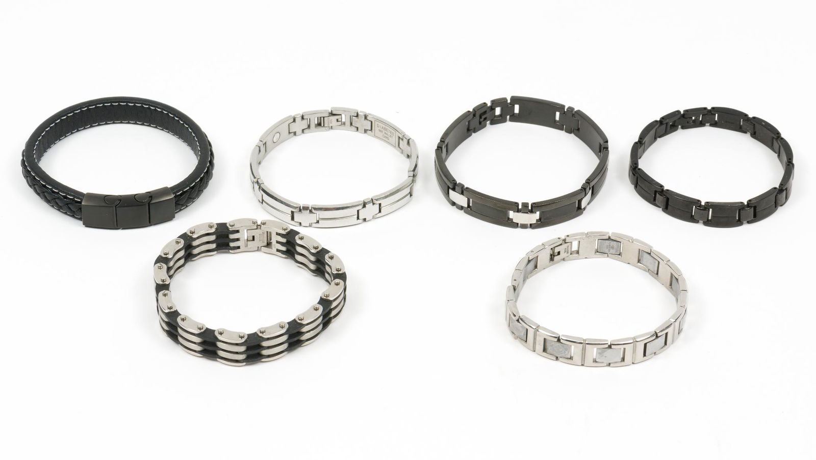 6 Mens Bracelets: Includes leather, Stainless Steel, and Titanium. 8"-8.5" long. LM IMPORTANT: Before bidding, please read the terms and conditions. When you registered for the auction you agreed to these terms and wil