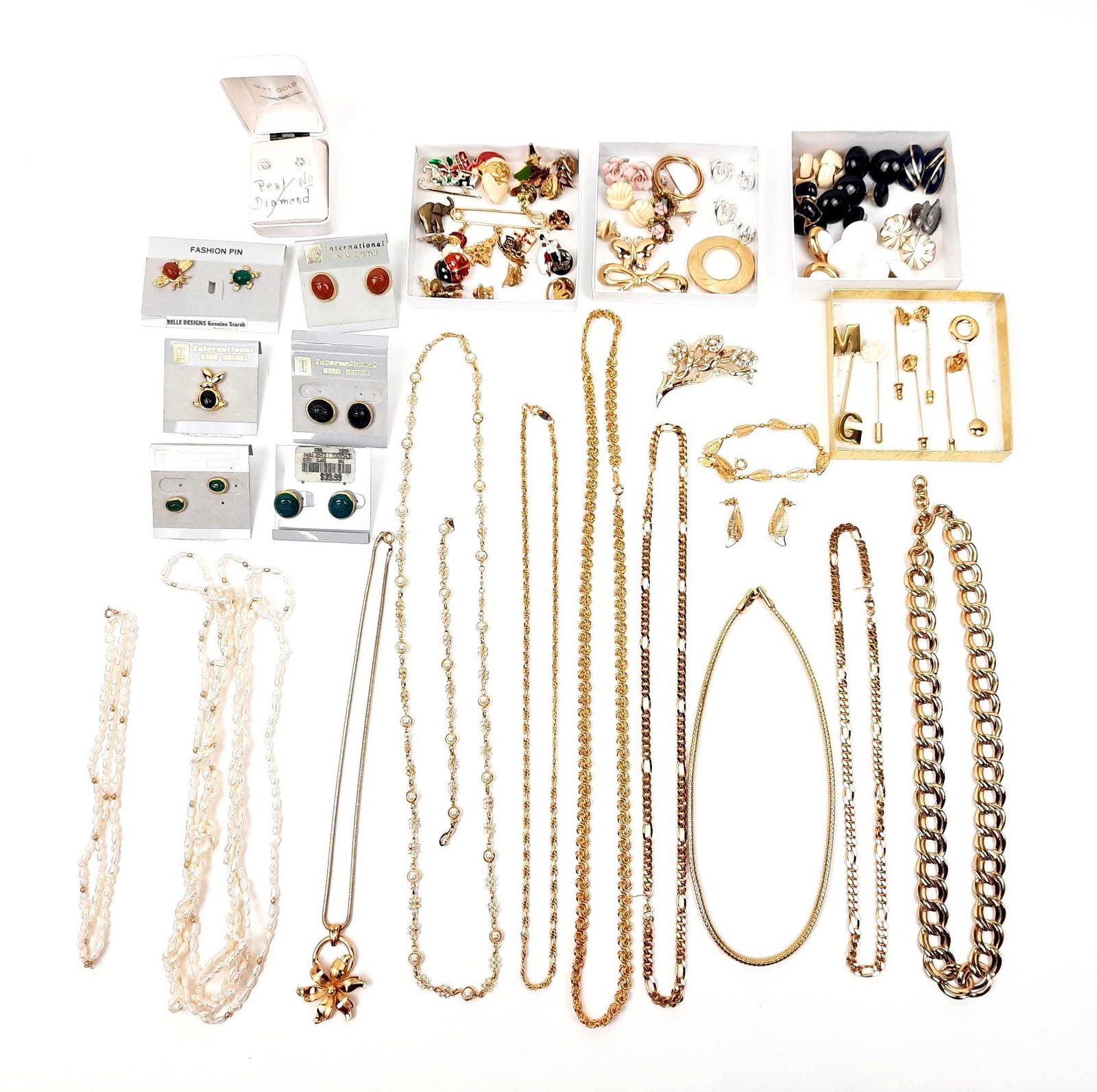 Large Grouping of Necklaces, Bracelets. Pins and Earrings incl Trifari: Also includes Monet. Chain length: 16" to 30" long. LR IMPORTANT: Before bidding, please read the terms and conditions. When you registered for the auction you agreed to these terms and will be requir