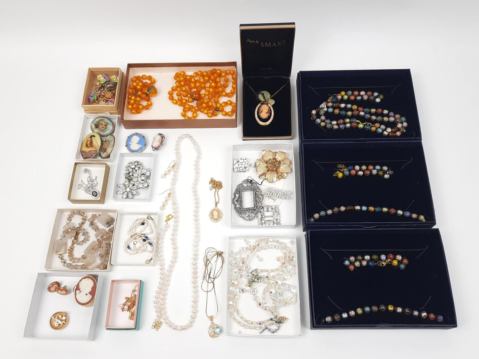 Grouping of Costume Jewelry incl Stauer: Includes necklaces, bracelets, pins, cameo and glass beads. LR IMPORTANT: Before bidding, please read the terms and conditions. When you registered for the auction you agreed to these terms and will b