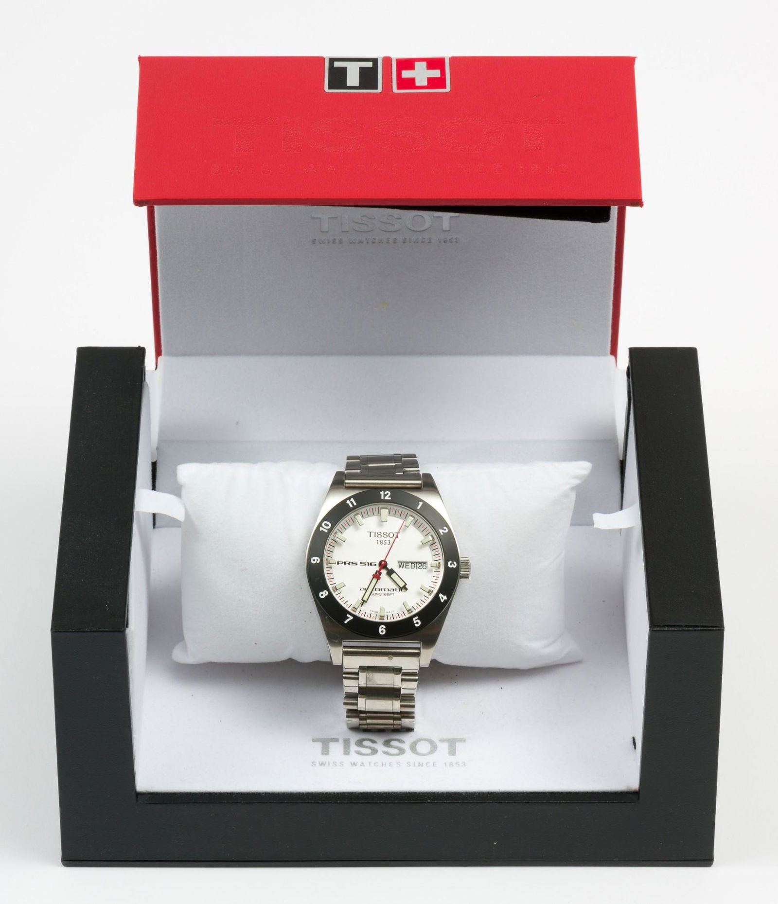 Tissot PRS 516 Wristwatch: White Dial and Black Bezel. Case length 2", lug to lug. LM IMPORTANT: Before bidding, please read the terms and conditions. When you registered for the auction you agreed to these terms and will be re