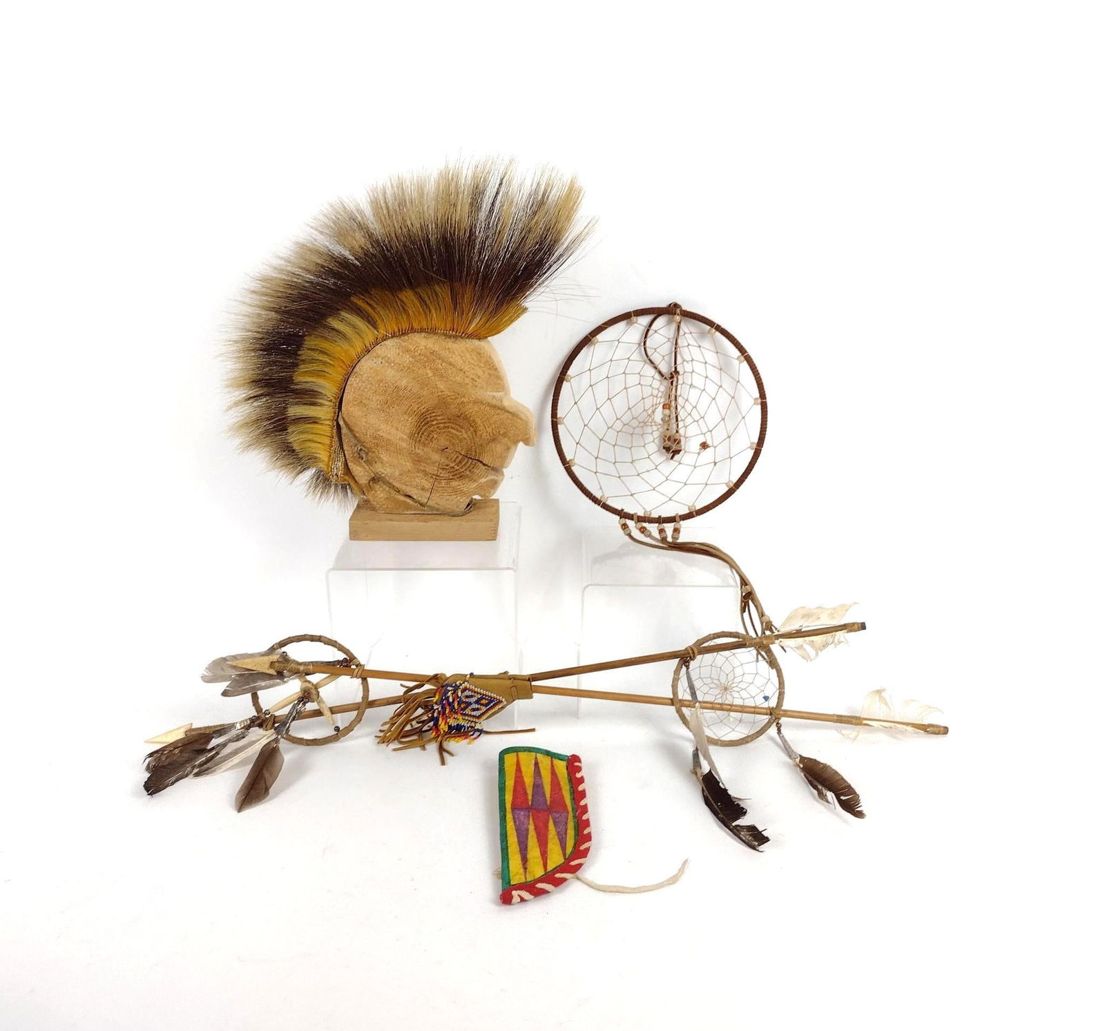 4 Native American Decorative Items: Includes: Men's dance roach with porcupine quill. Northern Plains dance sticks and Plains Indian sheath. Also includes dream catcher. MEG IMPORTANT: Before bidding, please read the terms and condition