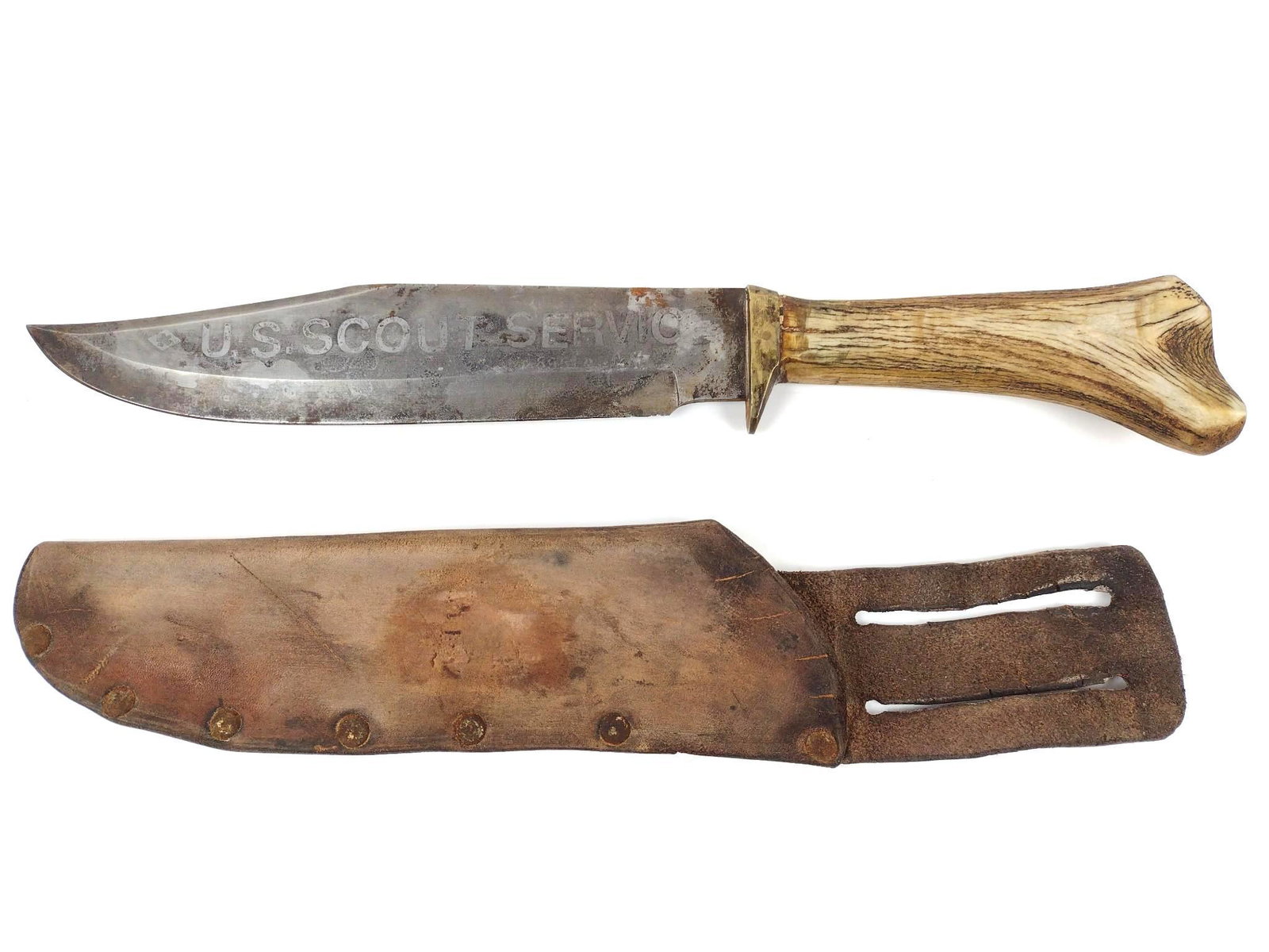 U.S. Scout Service Bowie Knife: With "U.S. Scout Service" to one side of the blade and "USS Forager" to the others with bone handle in leather sheath. Overall 16" long. MG. IMPORTANT: Before bidding, please read the terms and condit