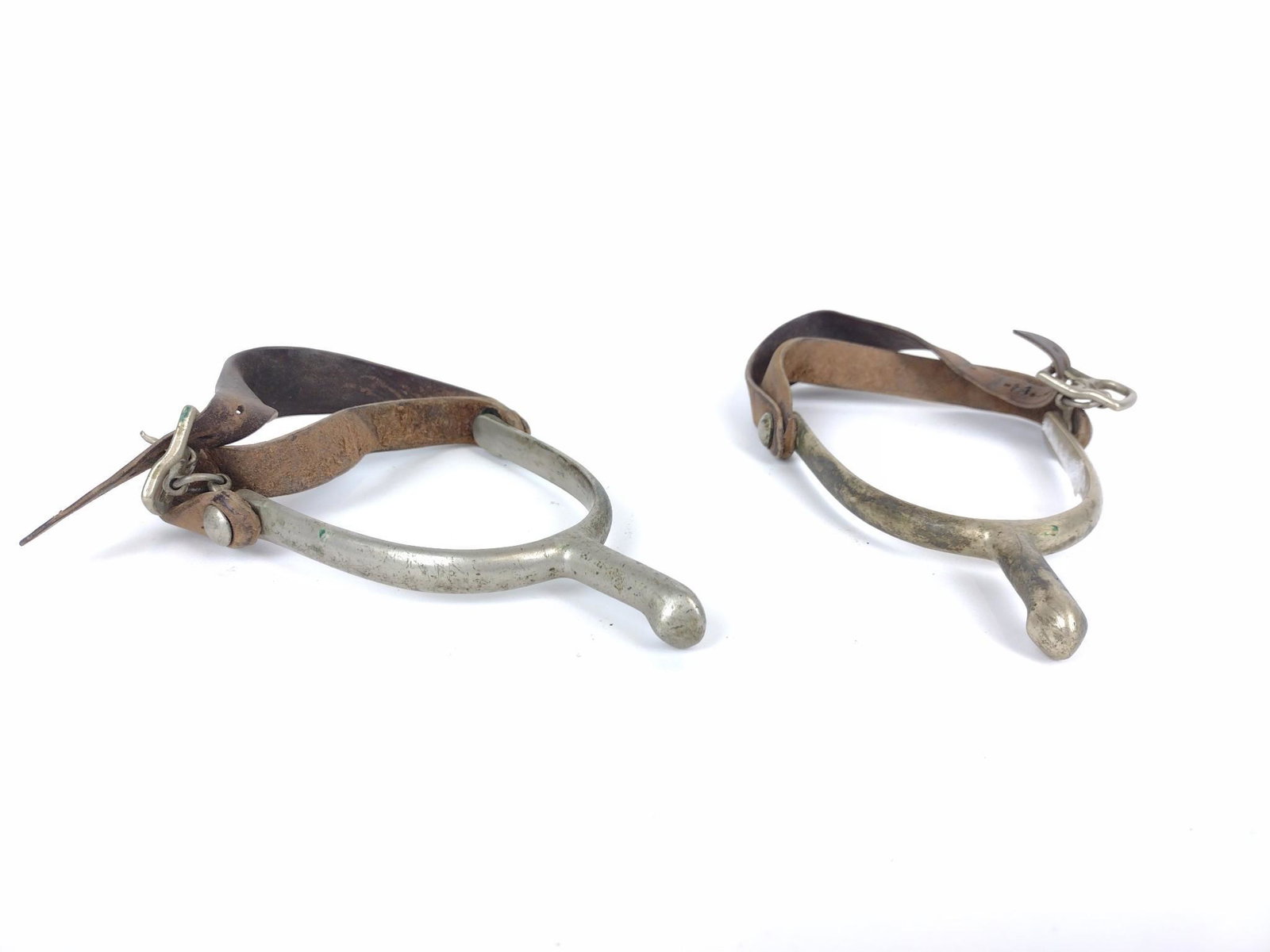 Pair Of US Calvery Spurs: Made by August Buermann. 4-1/4" wide X 5-1/4" deep. Some discoloring. MG. IMPORTANT: Before bidding, please read the terms and conditions. When you registered for the auction you agreed to these terms