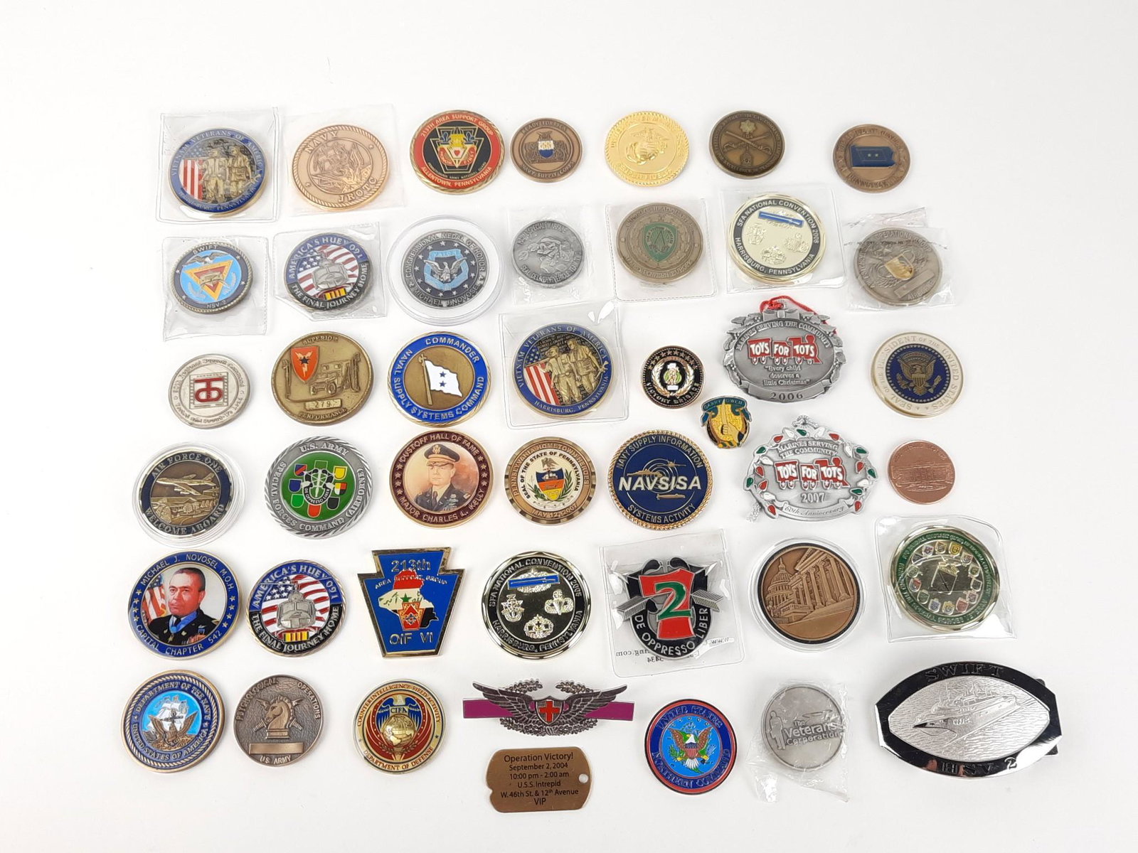 42 Challenge Coins, Tokens and Buckle: Also includes 2 Toys for Tots Marine Ornaments. 1-1/2" to 2-1/4" diameter. LR IMPORTANT: Before bidding, please read the terms and conditions. When you registered for the auction you agreed to these t