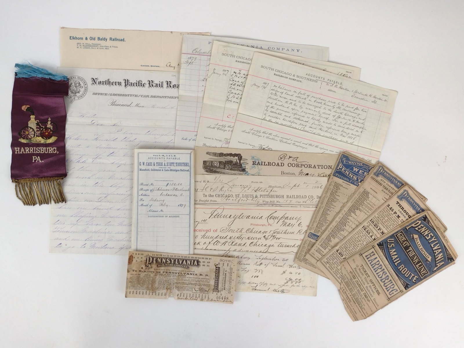 Group of 19th C Railroad Ephemera: Includes Pennsylvania Railroad schedules, receipt, letters, accounts payable, Harrisburg ribbon. MEG IMPORTANT: Before bidding, please read the terms and conditions. When you registered for the auctio