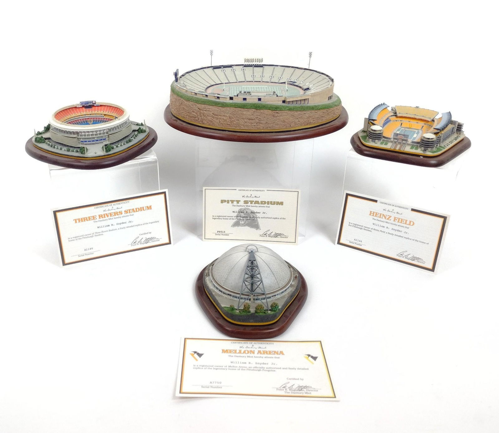 4 Stadium and Arena Replicas incl. Panthers: Also includes the Steelers and Penguins. Each with certificate of authenticity. 6-1/4" to 11-1/2" wide x 1/2" to 1" deep x 2" to 3" high. MEG IMPORTANT: Before bidding, please read the terms and condi