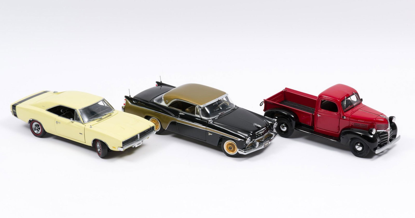 3 Danbury Mint Die Cast Classic Cars: Includes 1969 Dodge Charger R/T, 1956 Desoto Adventurer, and 1941 Dodge. Pick-up. All displayed. Pick-up with worn wheel front driver side. RM IMPORTANT: Before bidding, please read the terms and cond