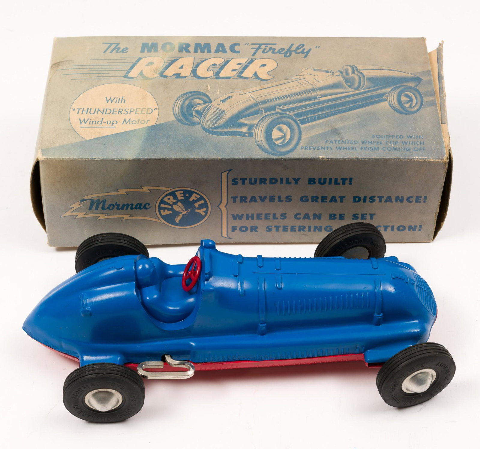 The Mormac Firefly Racer Wind-up in OB: With Thunderspeed Wind-up Motor. Model 302 in red. By Mormac Toys, USA. 10" long. In original box. Box with wear including denting. RM IMPORTANT: Before bidding, please read the terms and conditions. 