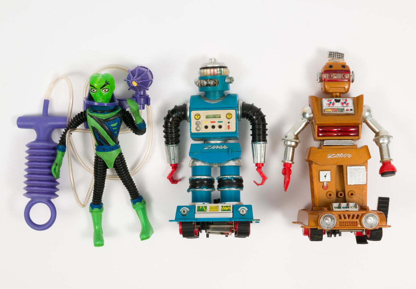 2 Ideal Zeroids Robots & Mattel Callisto Alien: Includes brown Zobor robot and blue Zerak robot. Also includes Major Matt Mason alien Callisto with air operated gun. Callisto made by Mattel, Hong Kong. Brown robot missing treads on bottom. RM IMPOR