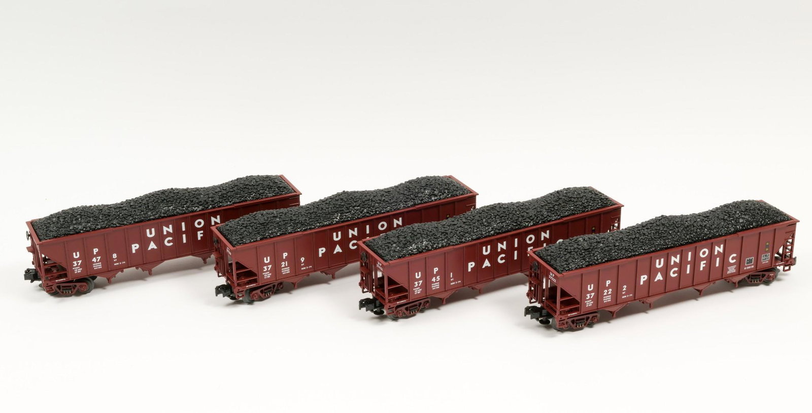 4 MTH Union Pacific Four Bay Coal Hoppers: 37219, 37222, 37451, and 37478. Trucks show little use. IMPORTANT: Before bidding, please read the terms and conditions. When you registered for the auction you agreed to these terms and will be requi