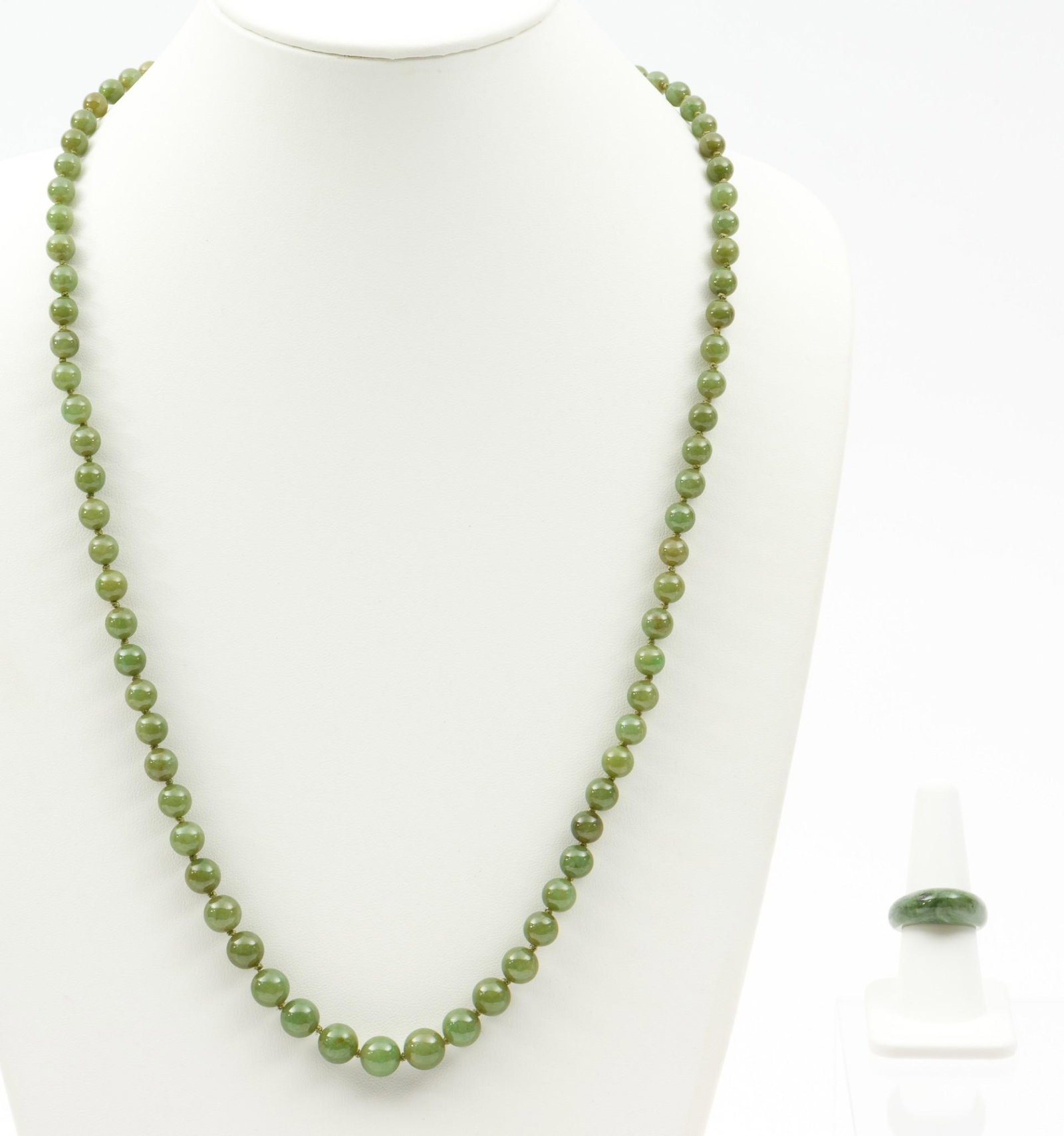 Jade Ring & Bead Necklace: Jade graduated bead necklace with gold-filled clasp. 29" long, beads 6.3 mm to 10.3 mm. Carved jade ring, size 8. EK IMPORTANT: Before bidding, please read the terms and conditions. When you registere