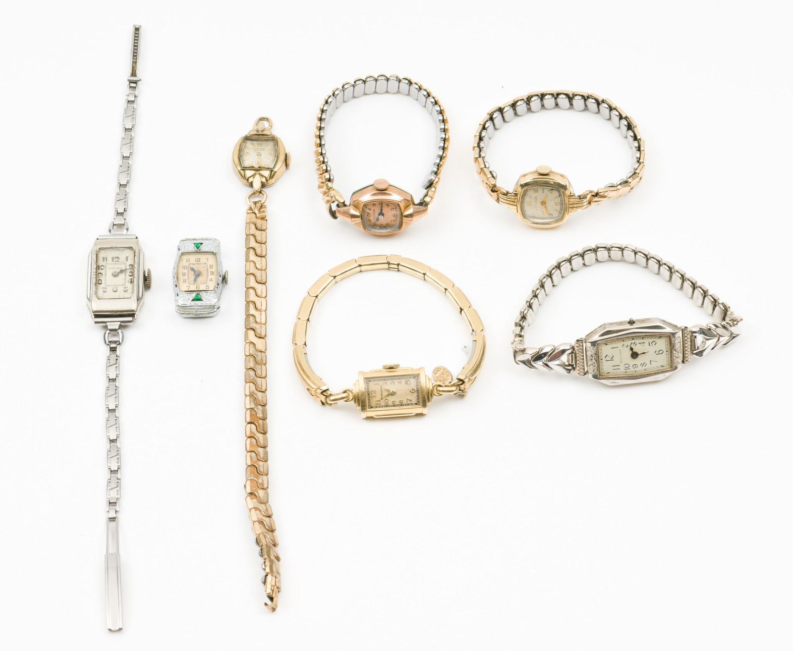 7 Antique Ladies Wrist Watches: Three Bulova, two Gruen, one Waltham, one Hamilton. Each in goldfilled cases. One Bulova without a band. 7/8" to 1-1/4" lug to lug. Waltham missing crown. Hands set on rest. One Bulova and two Gruens