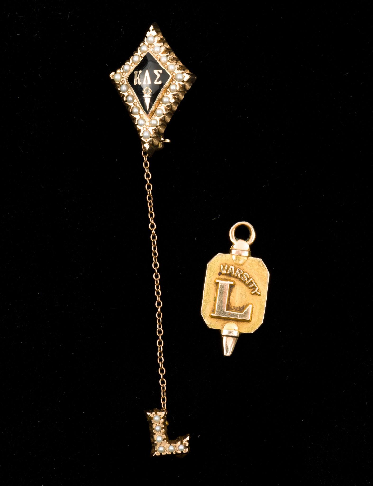 10K Sorority Pin and Varsity Charm: Kappa Lambda Alpha enamel and seed pearl pin 3/4" long. 1929 Varsity basketball charm 3/4" long. Both stamped 10K. 4.1 dwt total. MH. IMPORTANT: Before bidding, please read the terms and conditions. W