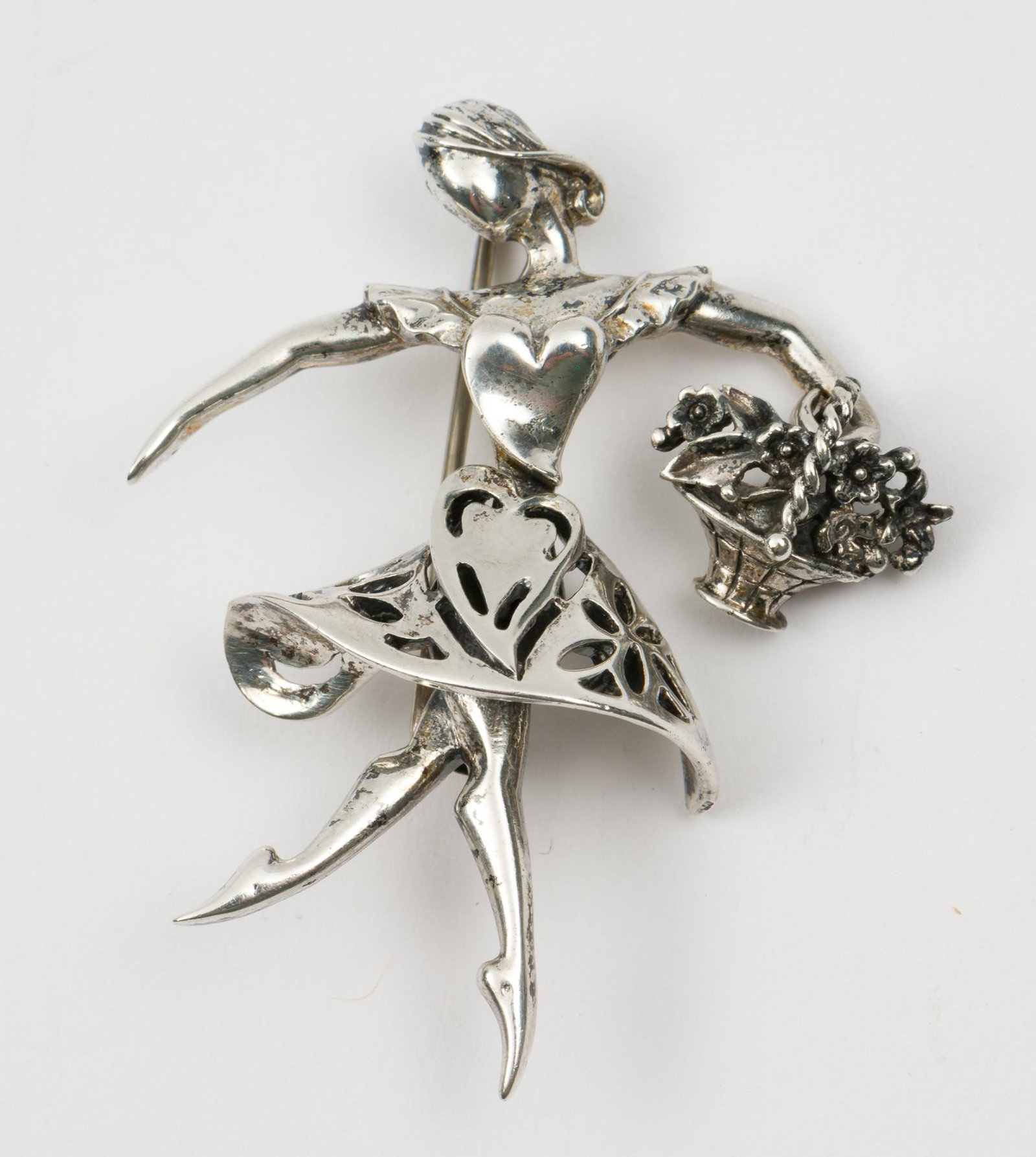 Alice Caviness Sterling Ballerina Brooch: Articulated bouquet. 1-3/4" high. MH. IMPORTANT: Before bidding, please read the terms and conditions. When you registered for the auction you agreed to these terms and will be required to comply with
