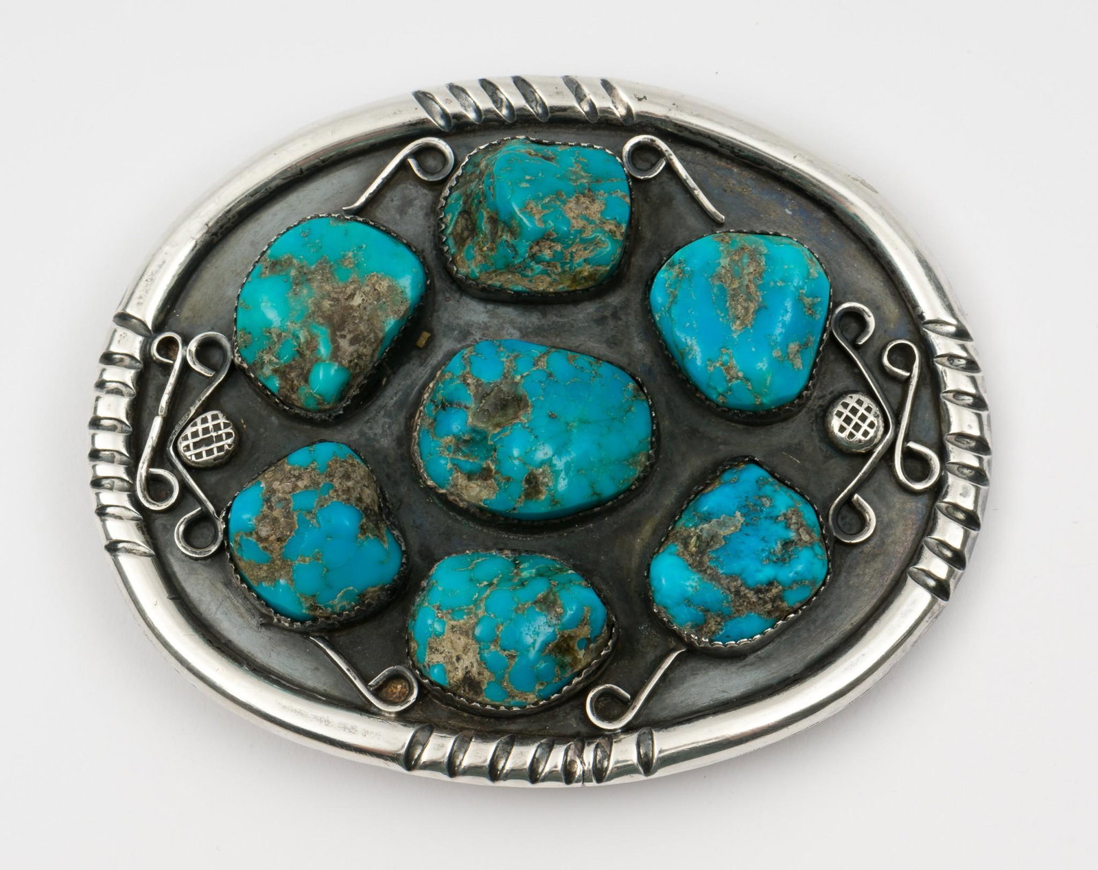 Navajo Silver & Turquoise Belt buckle: 3-5/8" wide, 2-2/3" high. MH. IMPORTANT: Before bidding, please read the terms and conditions. When you registered for the auction you agreed to these terms and will be required to comply with them.