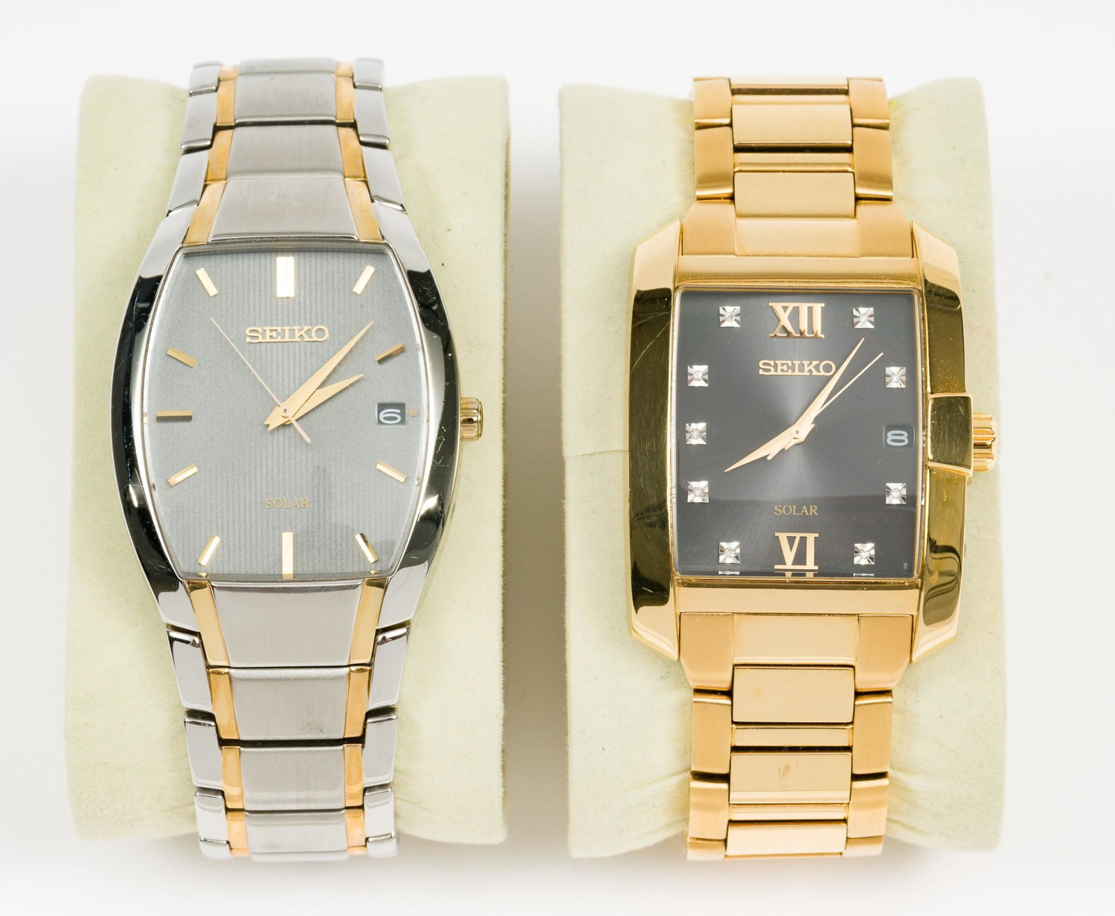 2 SEIKO Solar Wristwatches: V157-OCCO. V157-OATO. Case length for both 1 and 7/8", lug to lug. LM IMPORTANT: Before bidding, please read the terms and conditions. When you registered for the auction you agreed to these terms and