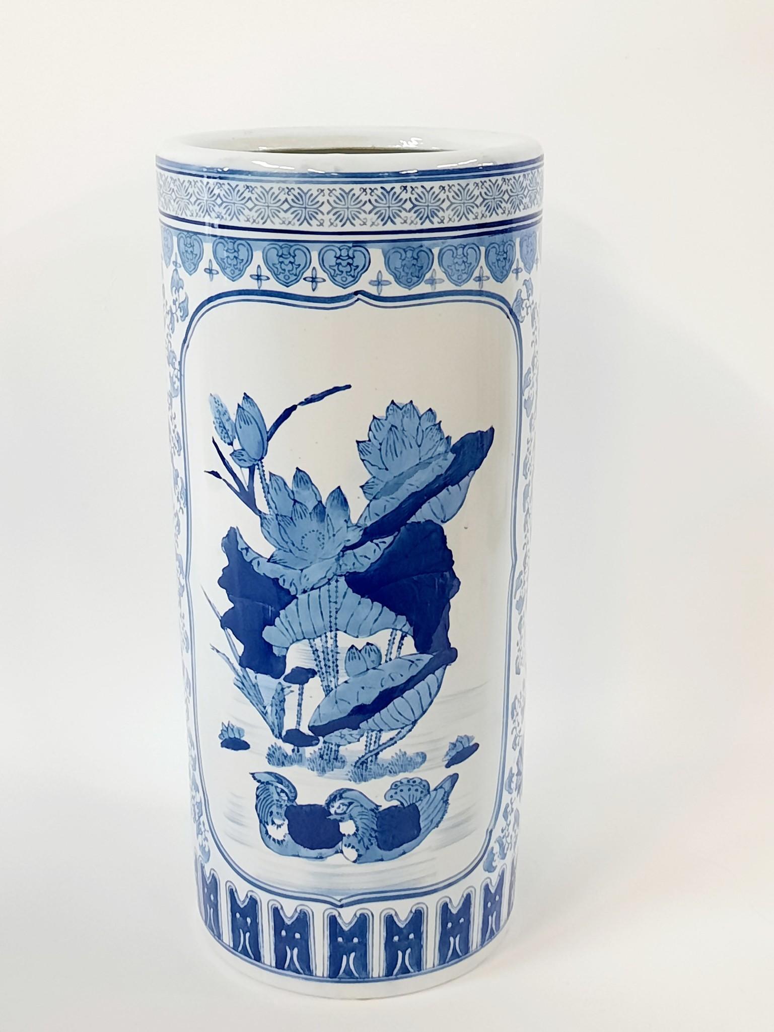 Blue and White Porcelain Umbrella Holder: 8-1/2" diameter x 20-1/2" high. LR IMPORTANT: Before bidding, please read the terms and conditions. When you registered for the auction you agreed to these terms and will be required to comply with th