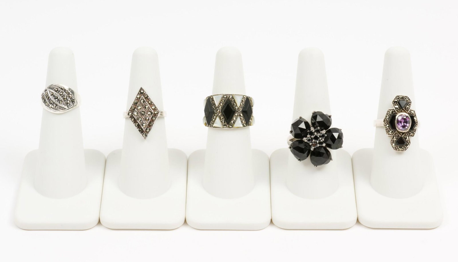 5 Sterling Fashion Rings: Including onyx and marcasite. Sizes 4-3/4 to 9-1/4. 3/8" to 3/4" wide. DP. IMPORTANT: Before bidding, please read the terms and conditions. When you registered for the auction you agreed to these term
