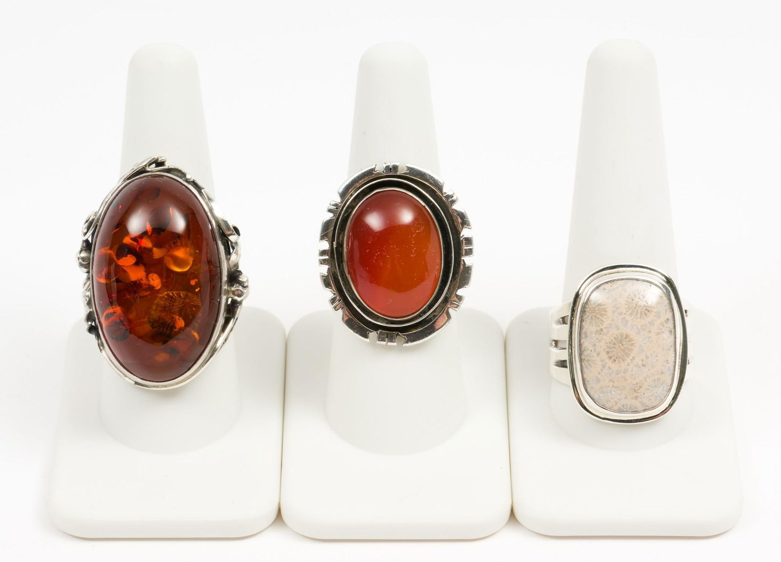 3 Sterling Rings Incl Amber: Two amber rings, one jasper. Sizes 8-3/4 to 11-1/2. 7/8" to 1-3/8" wide. DP. IMPORTANT: Before bidding, please read the terms and conditions. When you registered for the auction you agreed to these te