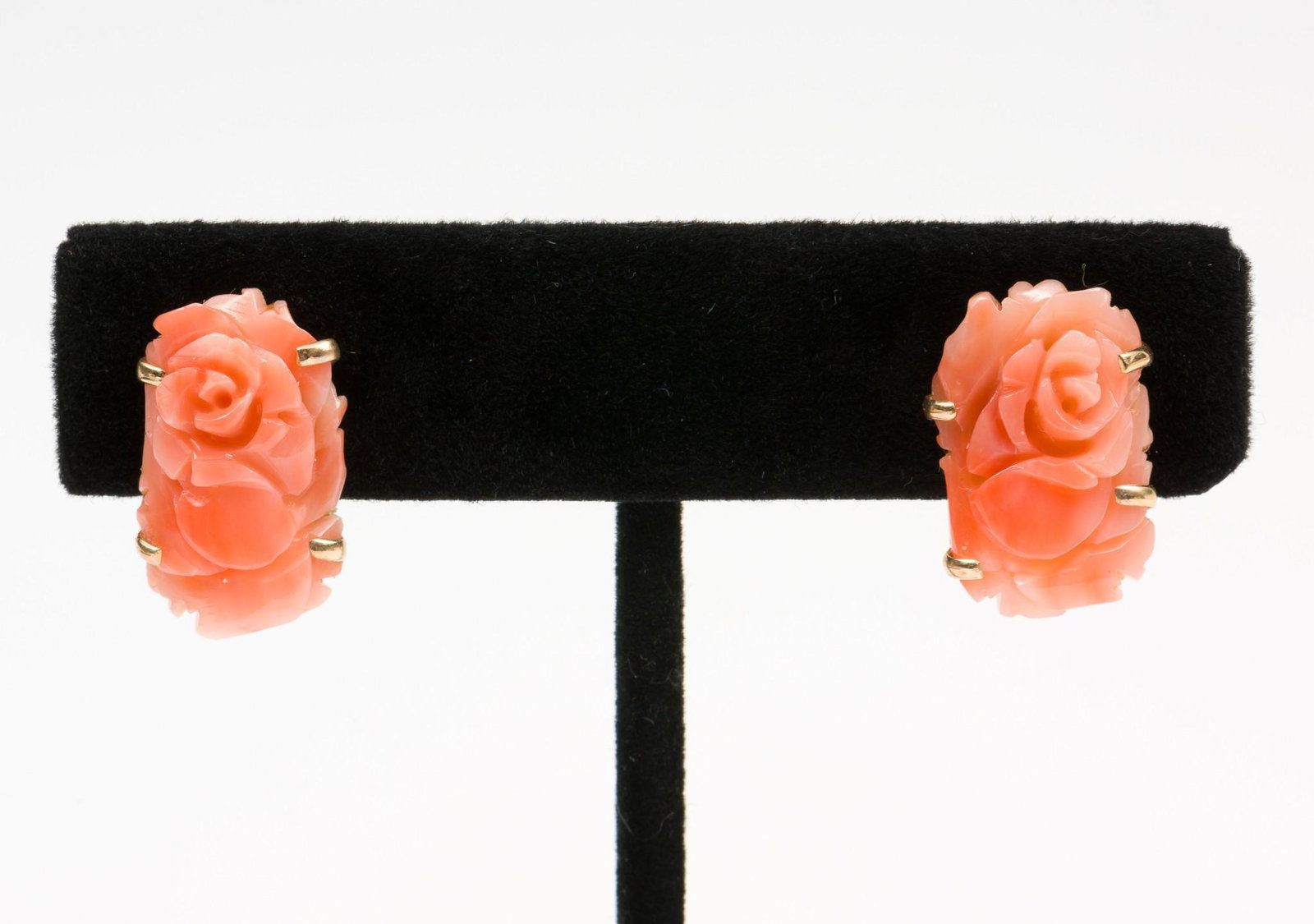 Ross-Simons 14K Carved Coral Earrings: Clip post. Marked 14K. In original bag. 3/4" long. DP. IMPORTANT: Before bidding, please read the terms and conditions. When you registered for the auction you agreed to these terms and will be requir
