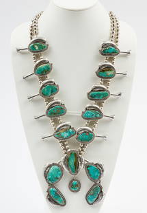 James Martin Navajo Squash Blossom Necklace: DESCRIPTION: James Martin Navajo sterling and turquoise squash blossom necklace. Signed to back of naja. MEASUREMENTS: Overall 28" long. Naja 4-1/2" long x 4-3/4" wide. Each blossom 2-1/2" wide.