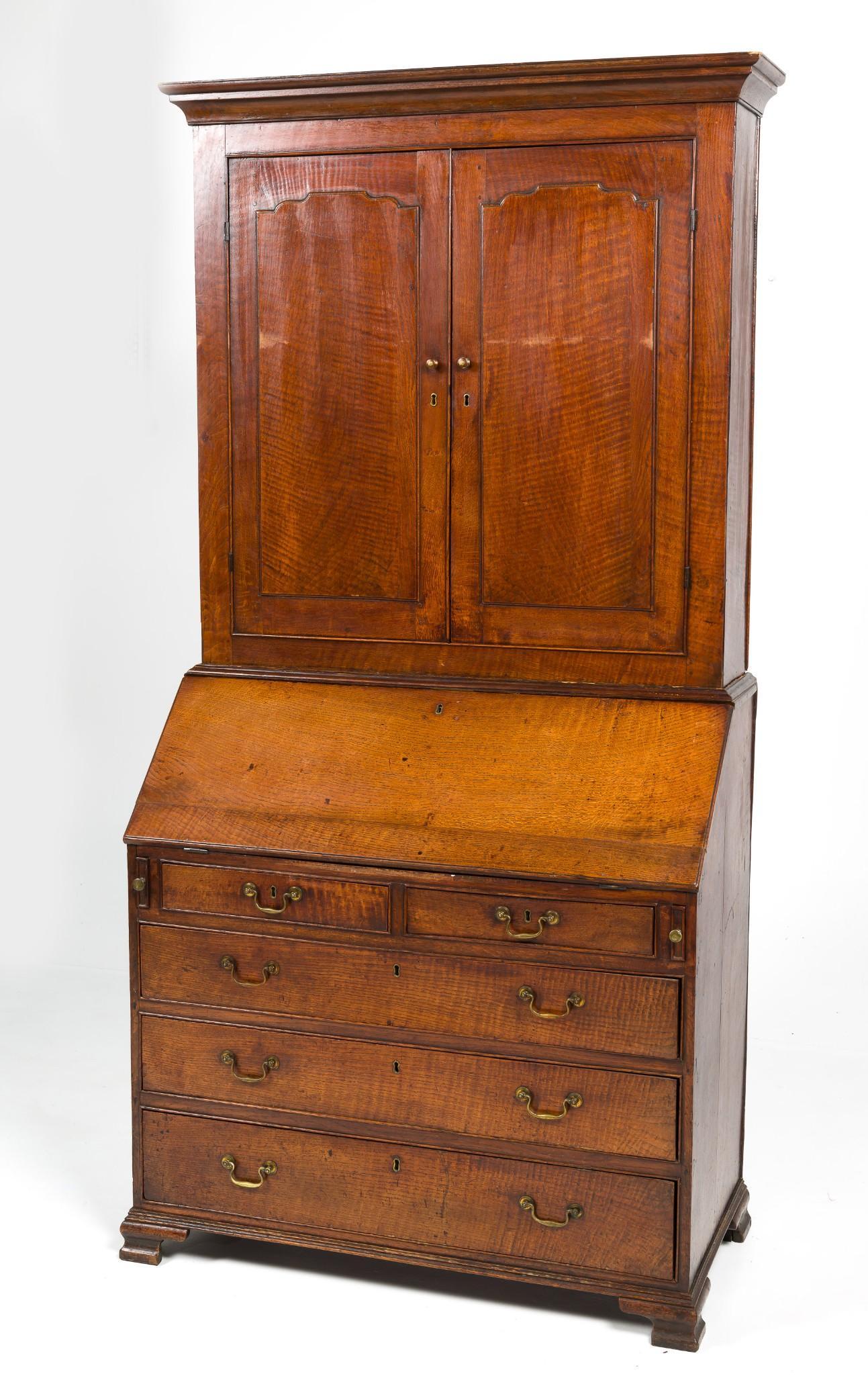 English Georgian Secretary: DESCRIPTION: English Georgian secretary. Desk and bookcase or secretary. Circa 1780-1810. Mixed woods. Form consisting of a five drawer chest with fall board writing surface resting on bracket feet. S