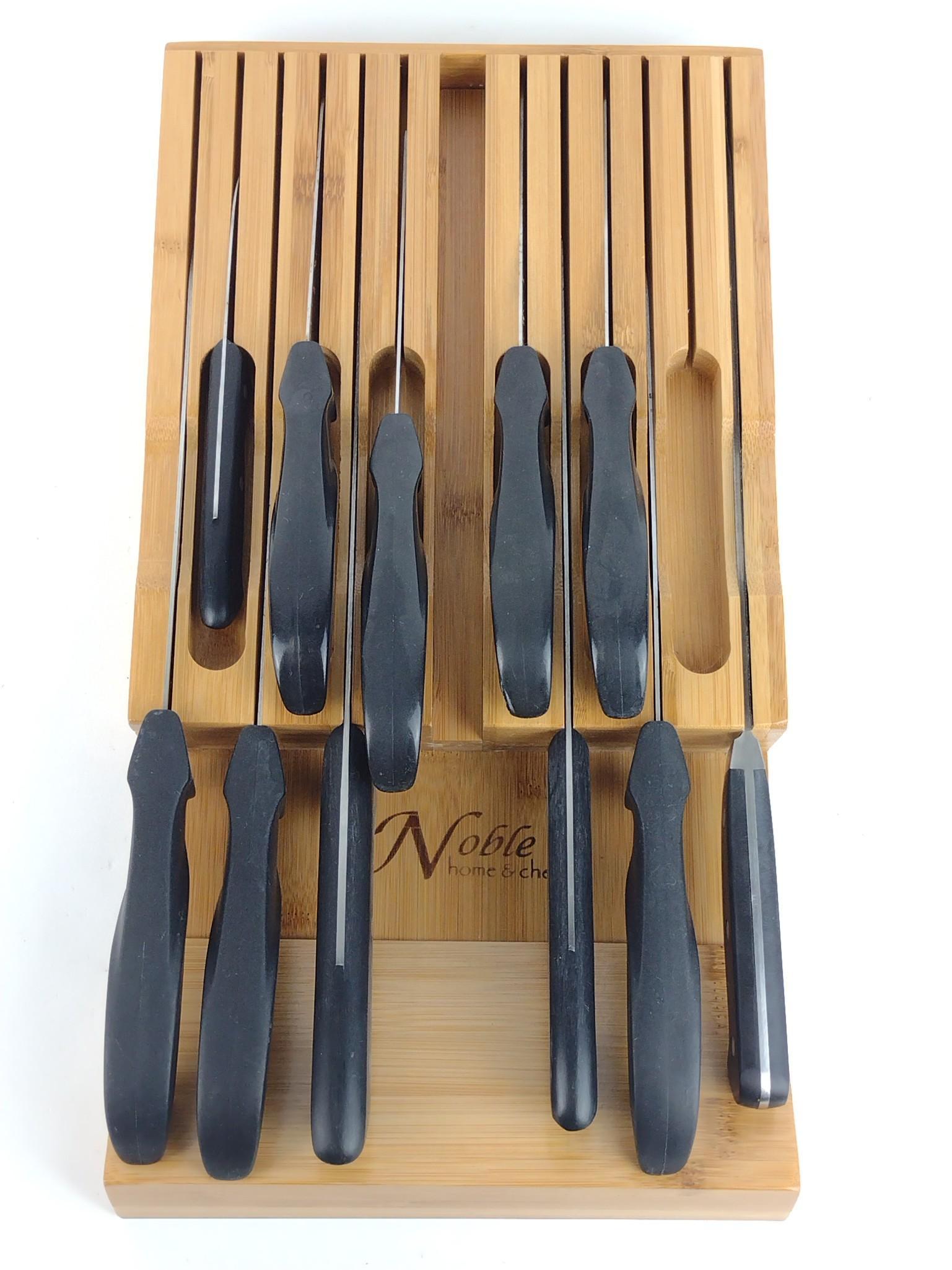 11 Knives in Holder Incl Sabatier and Solingen: Also includes (1) Solingen Rostfel, (7) Sabatier Cuisine France, and (3) Classic Line Rosterei. Holder 16-3/4" high x 9" wide. DP. IMPORTANT: Before bidding, please read the terms and conditions. When